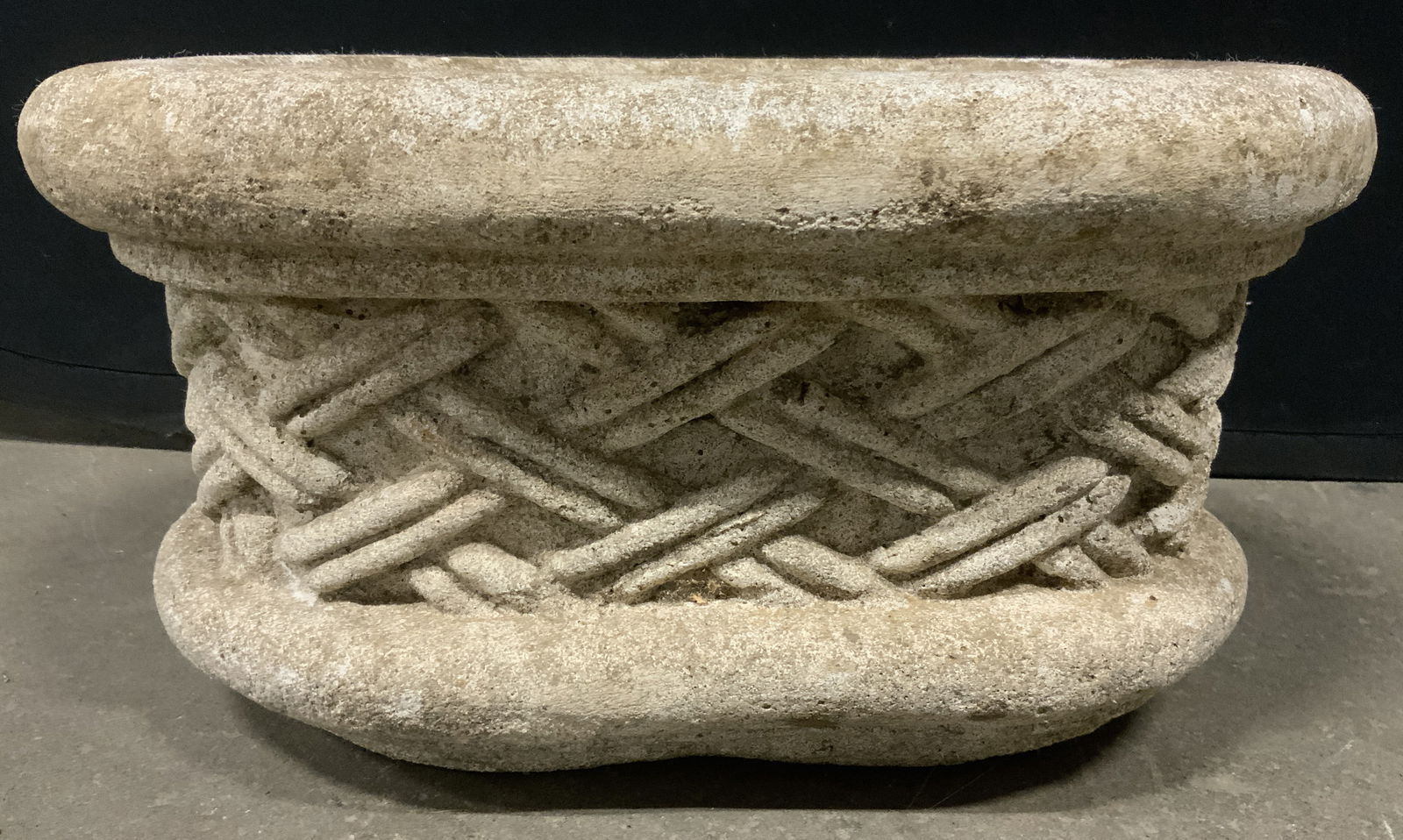 Vintage Concrete Weave Pattern Oval Planter: Planter is vintage. Piece has oval shape. Sides have woven pattern detail. Piece is cement. Measures approx 17 inches long 11 inches deep 9 inches tall. Planter, cement planter, oval planter, vintage