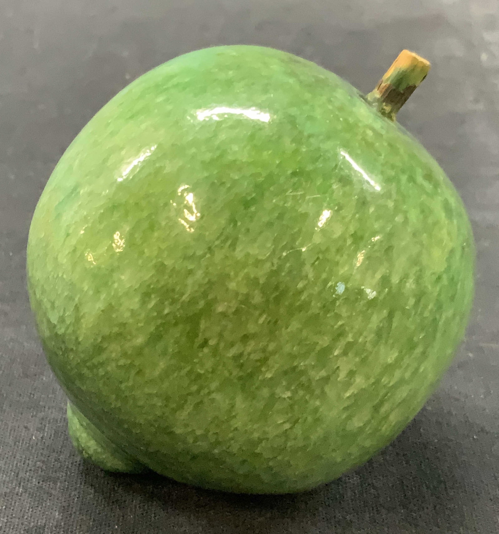 Vtg Green Polished Stone Fruit Replica: Vintage fruit replica made of a green posited stone with a wooden stem. Approx 3 inches tall and 3.25 inches long. Minor wearing to surface due to age and use. Vintage fruit decor, fruit accessories, 