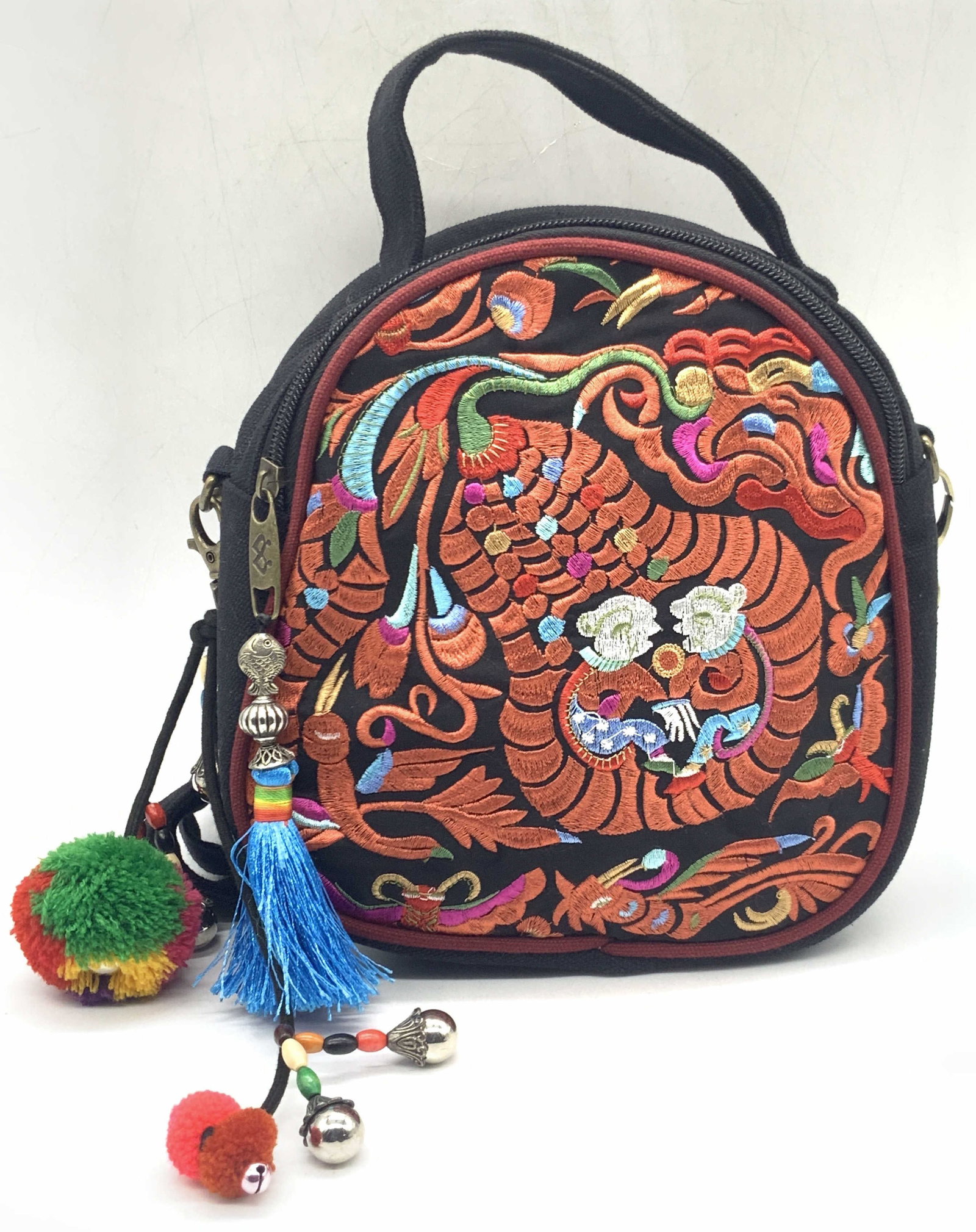 Canvas Embroidered Asian Style Shoulder Bag: A black canvas shoulder bag with embroidered front depicting floral images in red with a gourd with two people within it. Charms affixed to zipper and latches to shoulder strap. Shoulder strap drop le