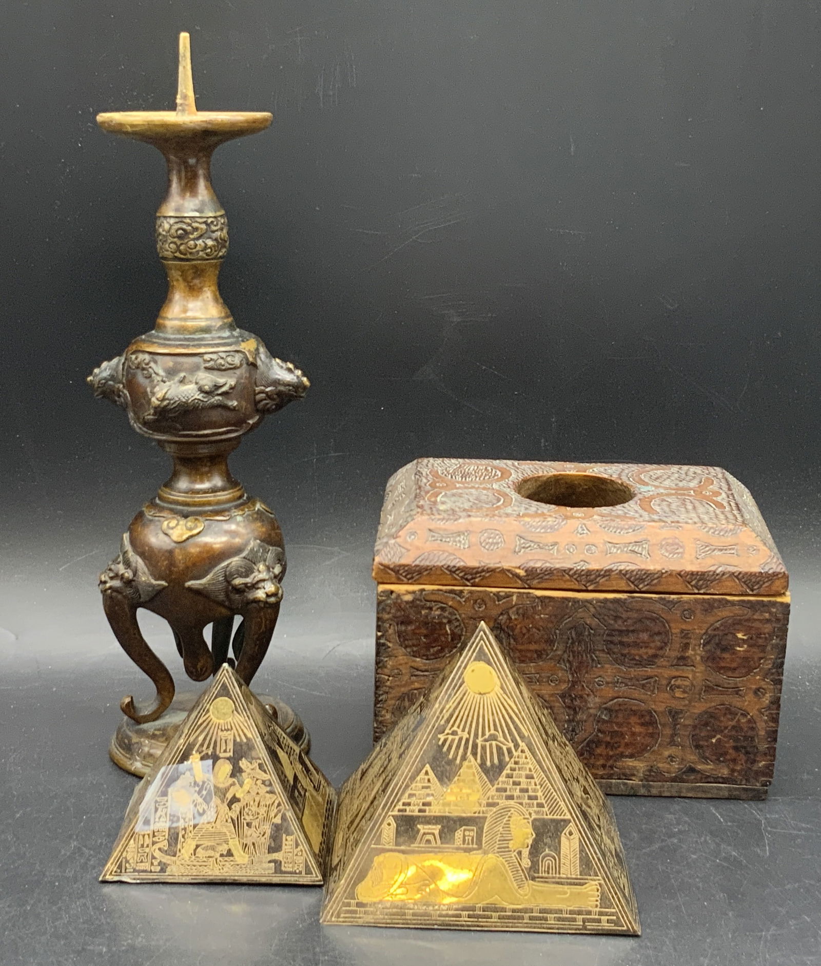 Lot 4 Antique & Vintage Tabletop Decor, Box & More: Four vintage and antique decorative objects. One signed Asian fu dog motif pricket candlestick crafted from bronze hued metal and signed with Asian characters on the underside. Two vintage etched meta