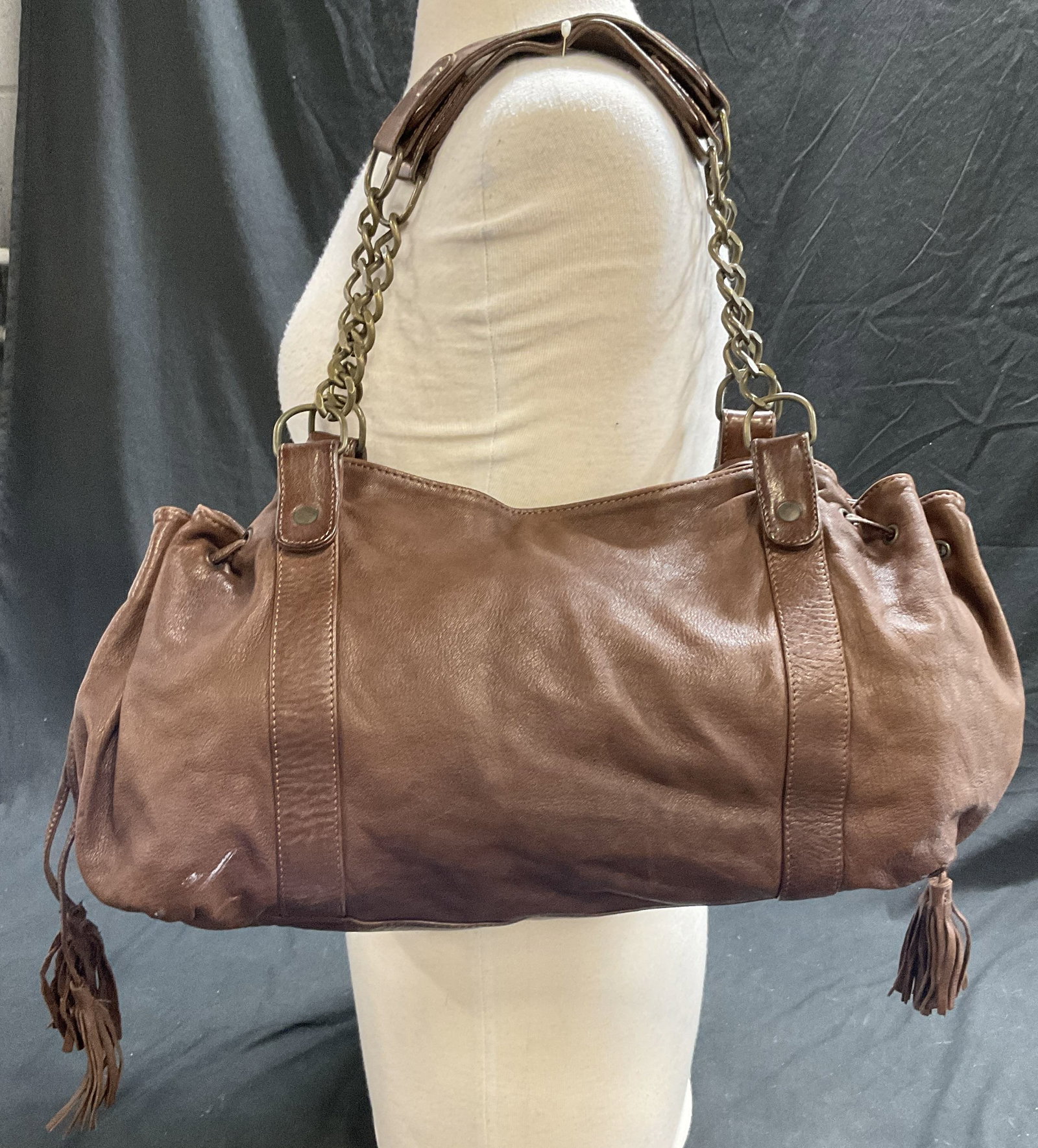GERARD DAREL Brown Lambskin Shoulder Bag. France: GERARD DAREL Brown Lambskin Shoulder Bag. Made in France. Two leather and chain shoulder straps. Magnetic closure. One interior zippered pocket. Some surface wear consistent with age, and use. Some re