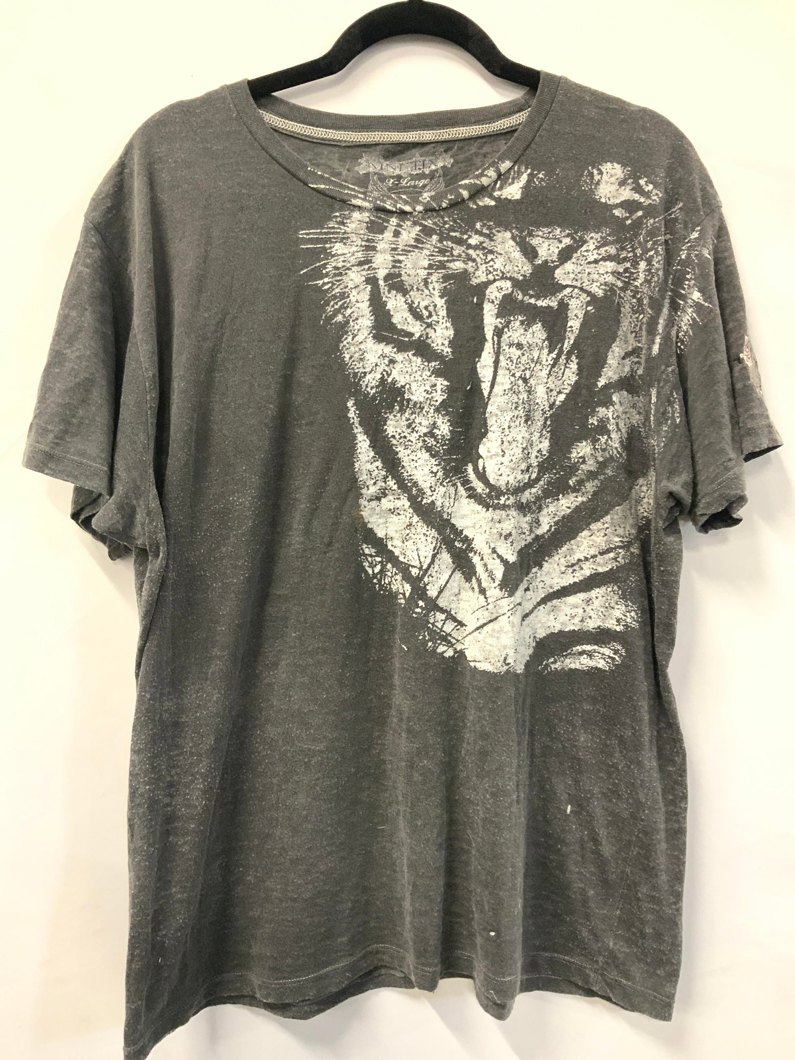 Kinetix Tiger Graphic T Shirt XL: Gray toned partly sheer t shirt with a white graphic of a growling tiger, marked Kinetix XL on backside of shirt. Torso measures 21 inches across and 16 inches long from arm inseam. Evident blemish to