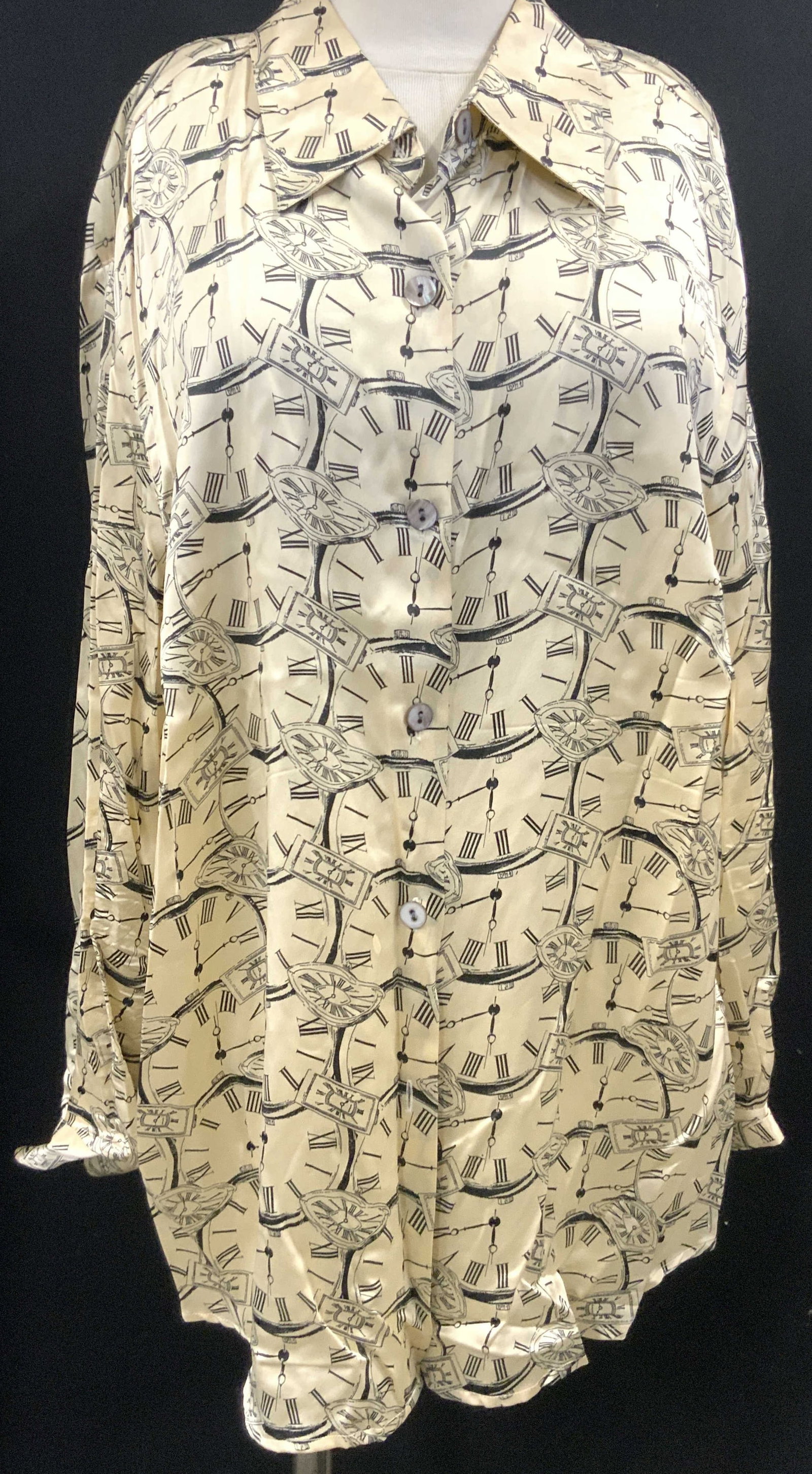 Rafaella Silk Clock Graphic Button Up: Marked on tag Rafealla, 100% Silk. Tan toned with clock graphics throughout. Size 20. Torso measures 22.5 inches across from arm inseams and torso measures 16 inches long from arm. Sleeves measure 22 