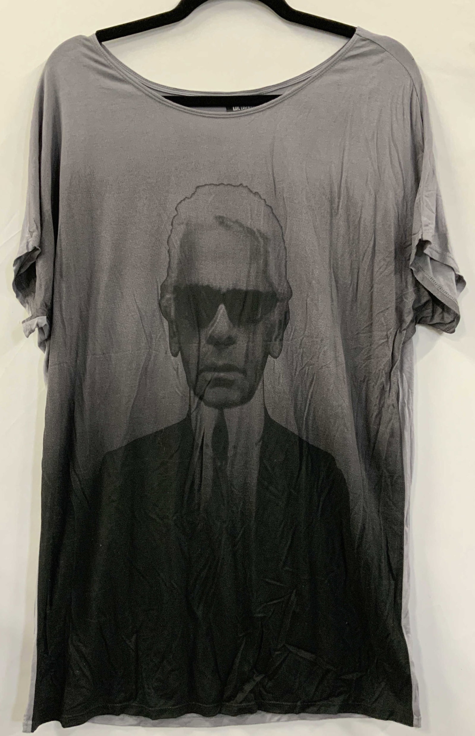 KARL LAGERFELD Portrait Graphic T Shirt: Tag marked Karl Lagerfeld, size Large, 100% Rayon. Depicts a front facing portrait of Lagerfeld in chromatic colors. Torso measures 22 inches across and 18 inches from sleeve inseam. Moderate wearing 