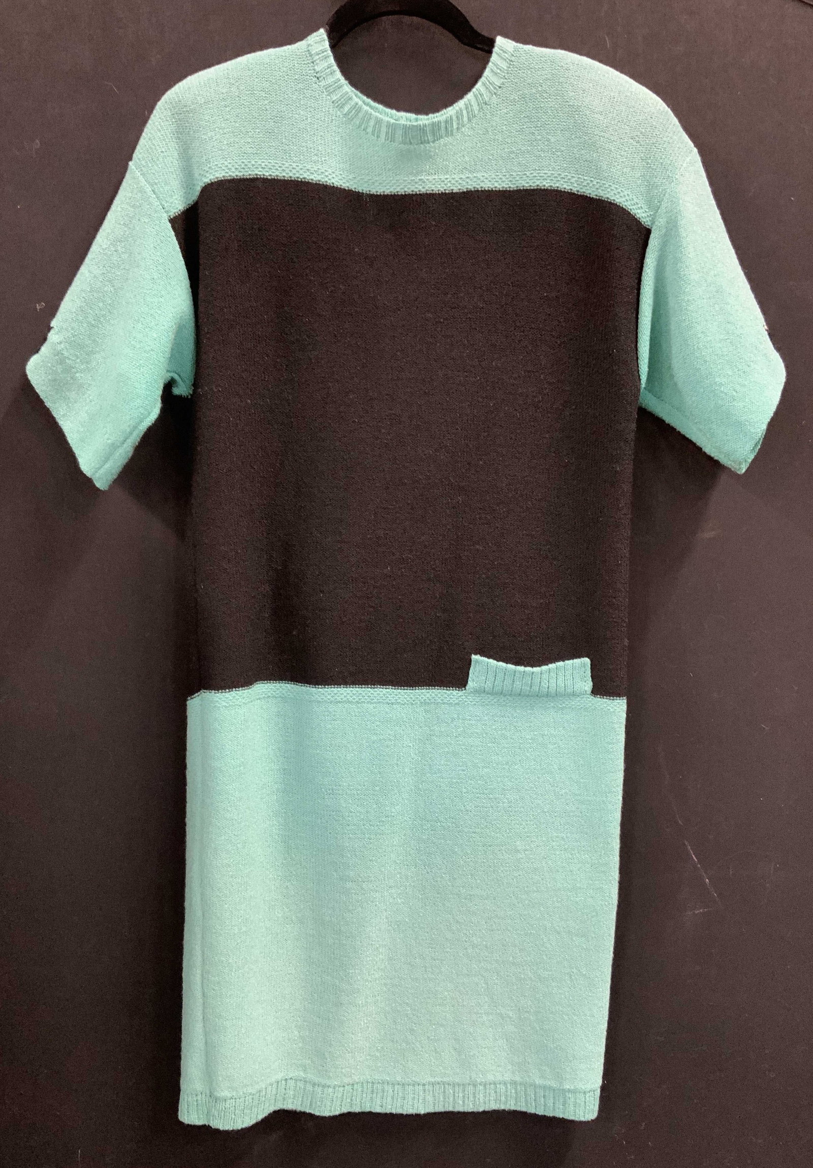 Steve Fabrikant Knit Color Block Dress: Vintage Knit Dress with color block black and aqua, shoulder pads. Possibly acrylic knit. Button closure on backside. 33-35 in. Waist. 35 in. Long. Vintage wear, knitwear, dress, Designer Steve Fabrik
