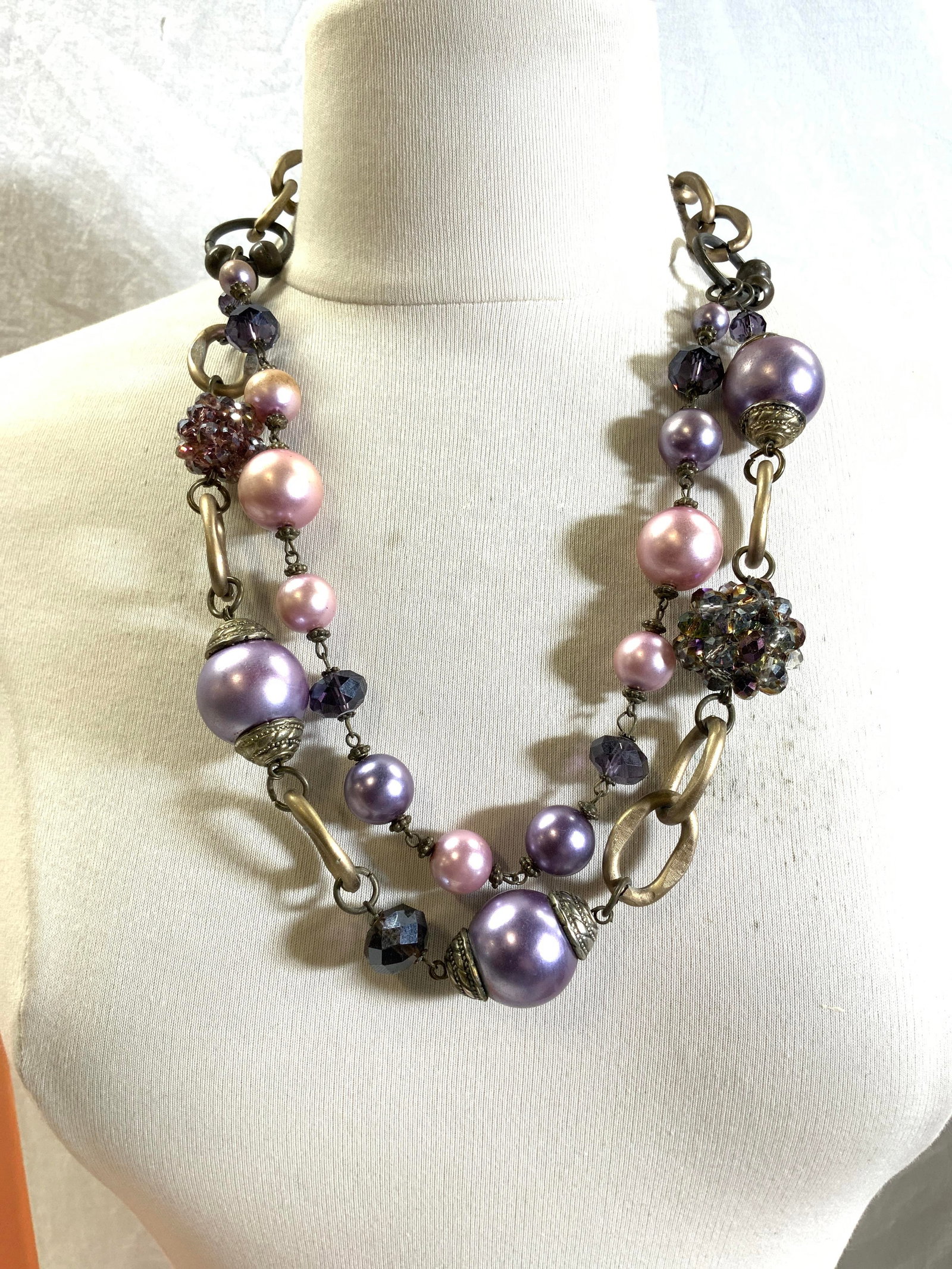 Chunky Faux Pearl & Aurora Borealis Necklace: Chunky and weighted cocktail necklace with large metal links , large lavender and pink faux pearls and cluster faceted Aurora borealis beads in amethyst. double strand with extender. Drop is 9.5- 10 i