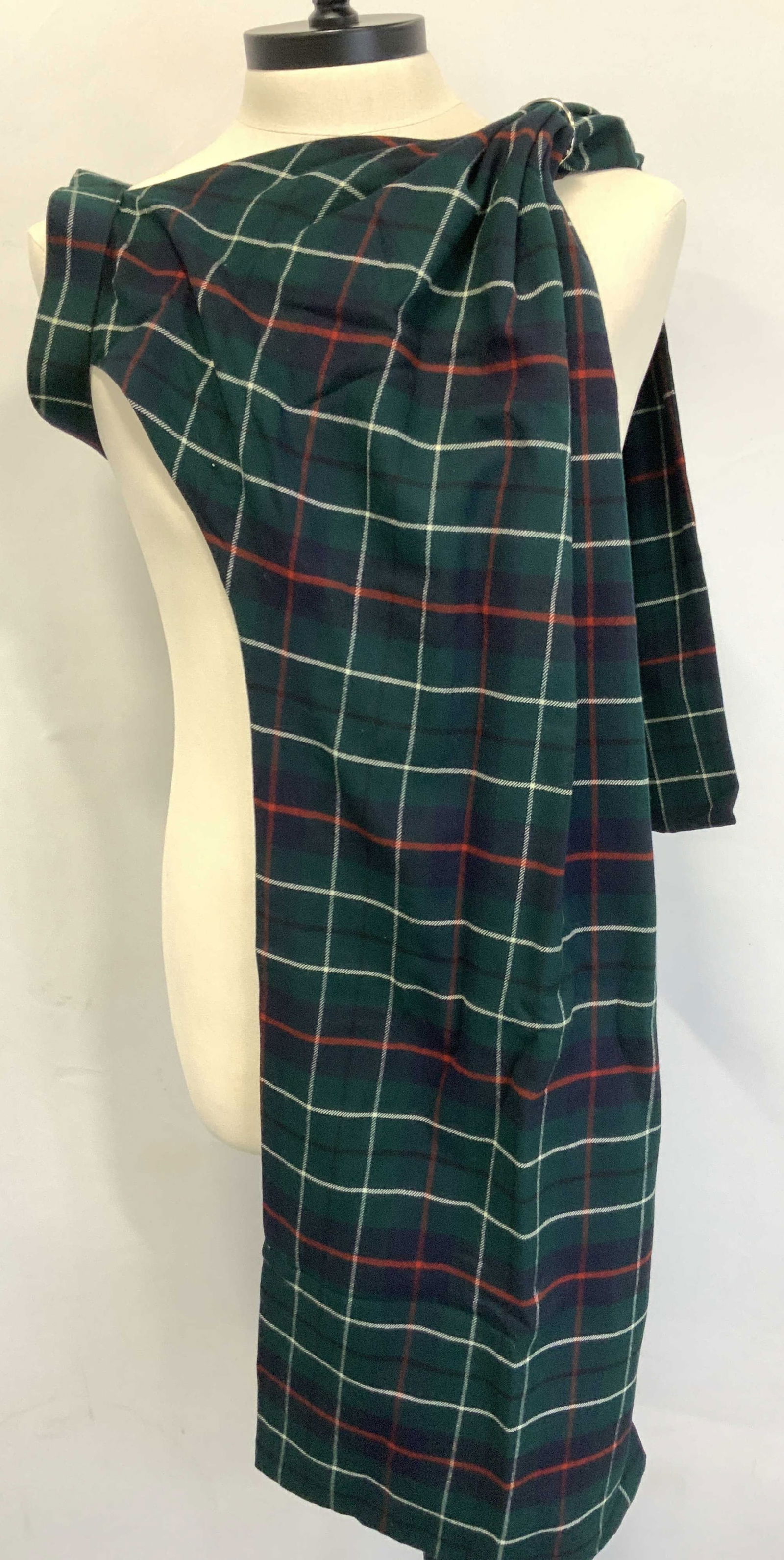 Wool Tartan Patterned Sash Fashion Accessory: Wool Tartan plaid drape sash accessory with leather strap on side and wide fabric coming from each side. Total length is 70 inches long. Evident wearing to leather on strap and moderate tears to wool,