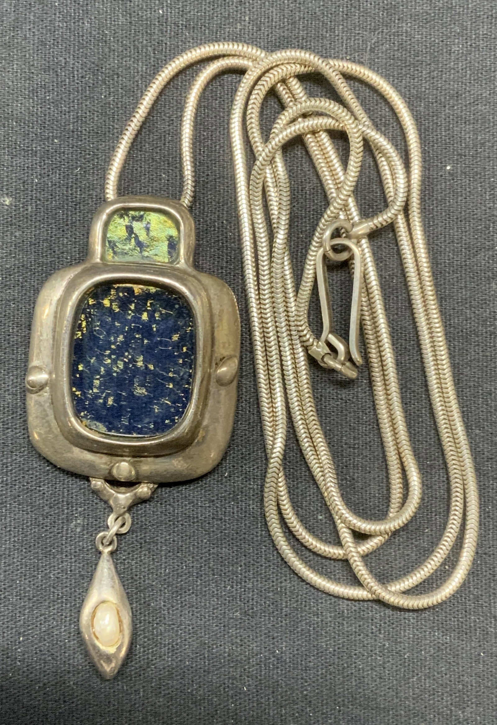 Sterling Silver Modernist Pendant Necklace: Modernist pendant necklace. Pendant tests for sterling using PuriTEST kit, chain untested. Blue glass and faux pearl decoration on pendant. Drop length approx. 18 inches. Pendant measures approx. 3 x 