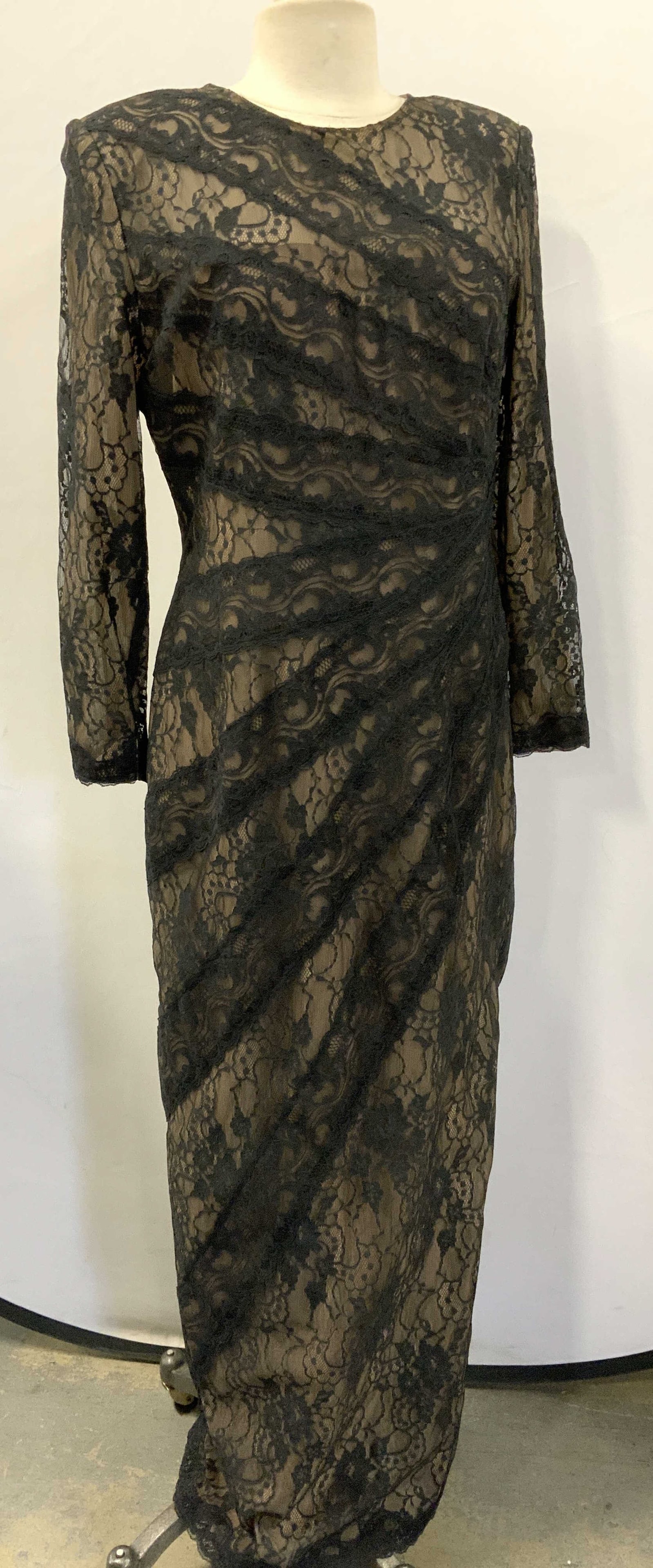 Victor Costa Black Lace Cocktail Gown, USA: Victor Costa for Nahdree ankle length lace dress over nude lining. Side slit for walking. Size 12. 49.5 in. Long. Made in USA. Lining and lace are polyester. Cocktail gown, Designer Victor Costa dress