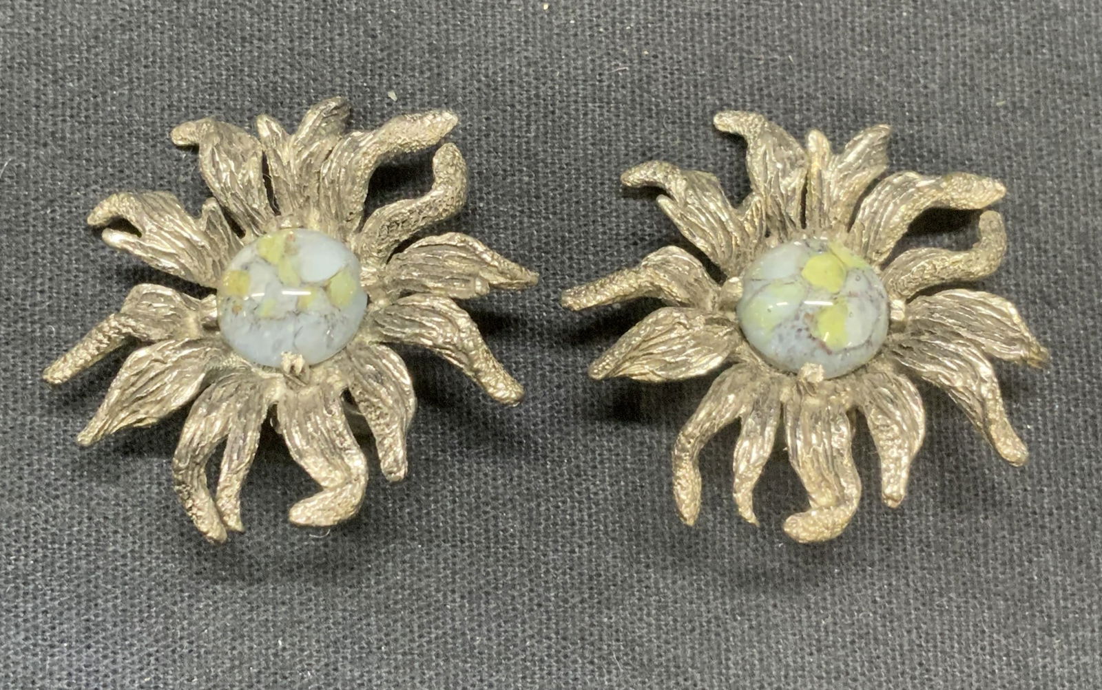 Vintage Silver Tone Lucite Flower Earrings: Vintage silver tone sculptural flower earrings. Blue and green toned lucite cabochon decoration. Clip on backing. Unsigned, numbered 6120. Measures approx. 1 3/8 inches diameter. Possibly Boucher. Est