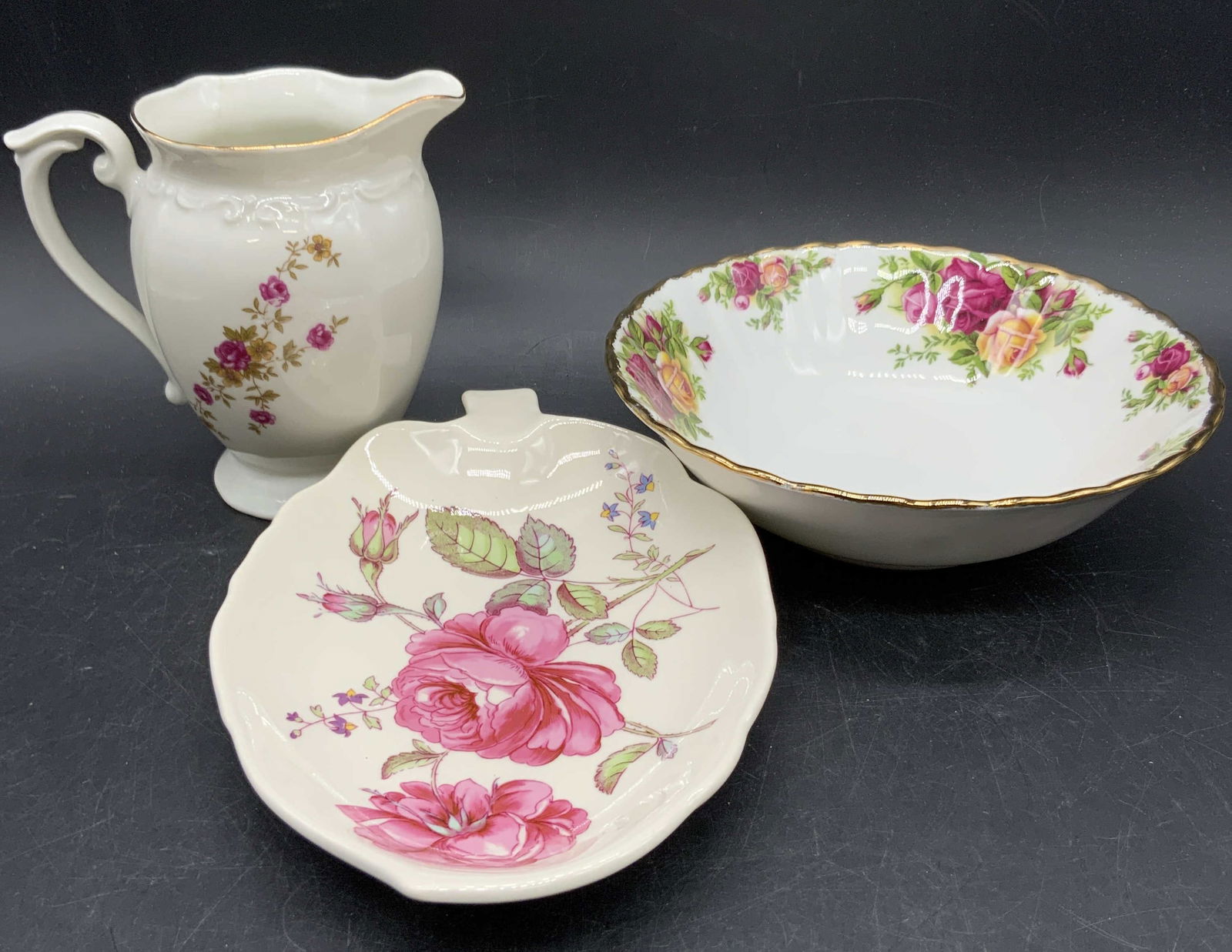 Lot 3 Vintage Porcelain Tableware, SPODE & More: Three vintage porcelain tableware items. A creamer pitcher, a bowl, and a leaf form plate. Pieces feature floral motifs. Undersides signed SPODE ENGLAND 72, OLD COUNTRY ROSE 1962 ROYAL ALBERT BONE CHI