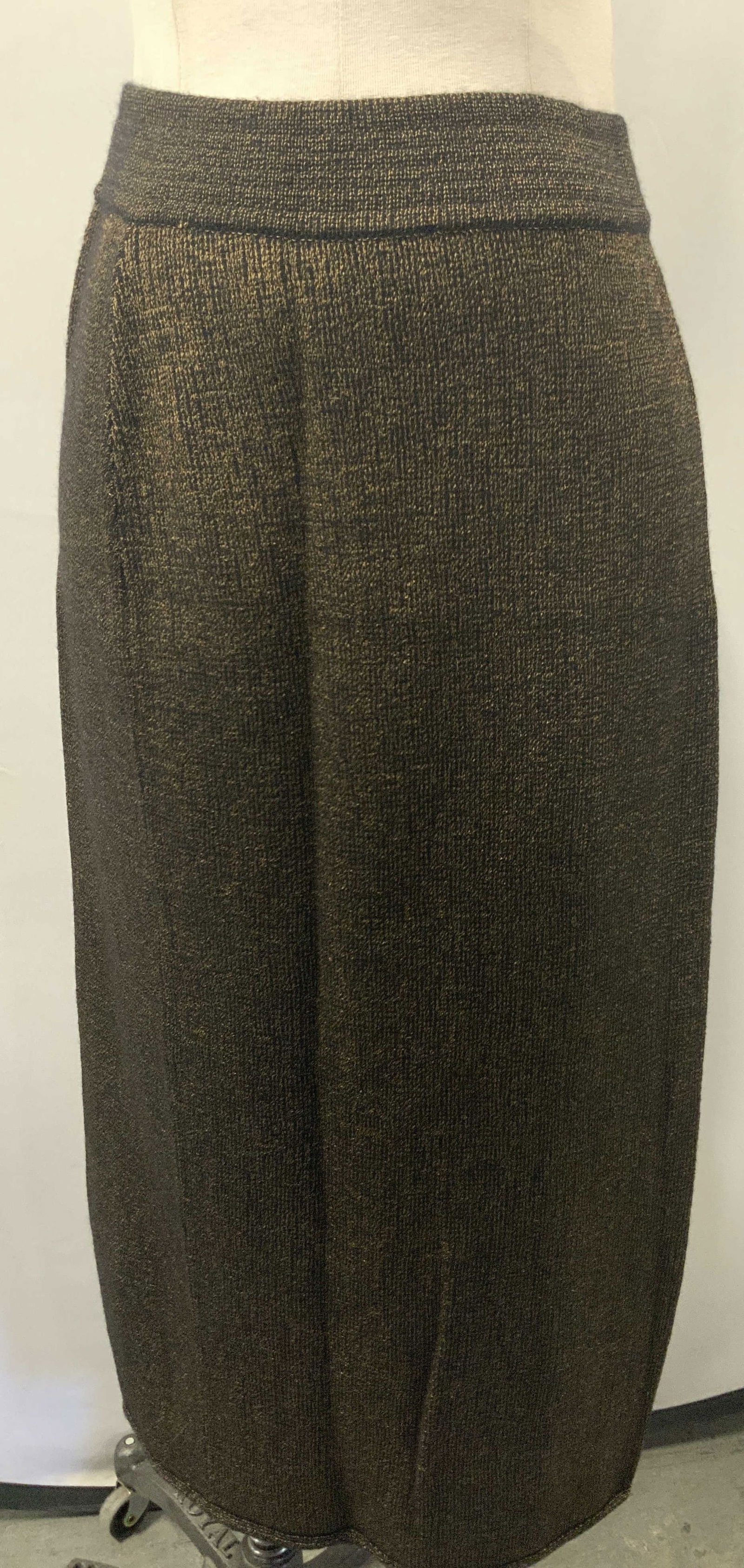 ERTE Wool Pencil Skirt, Italy: Marked on tag Erte, realized in Italy, 55% wool 25% Viscose 15% Angora 5% Nylon. Pencil skirt in black and gold threading. Waist is approx 24 inches wide, length from waist band is approx 32 inches lo