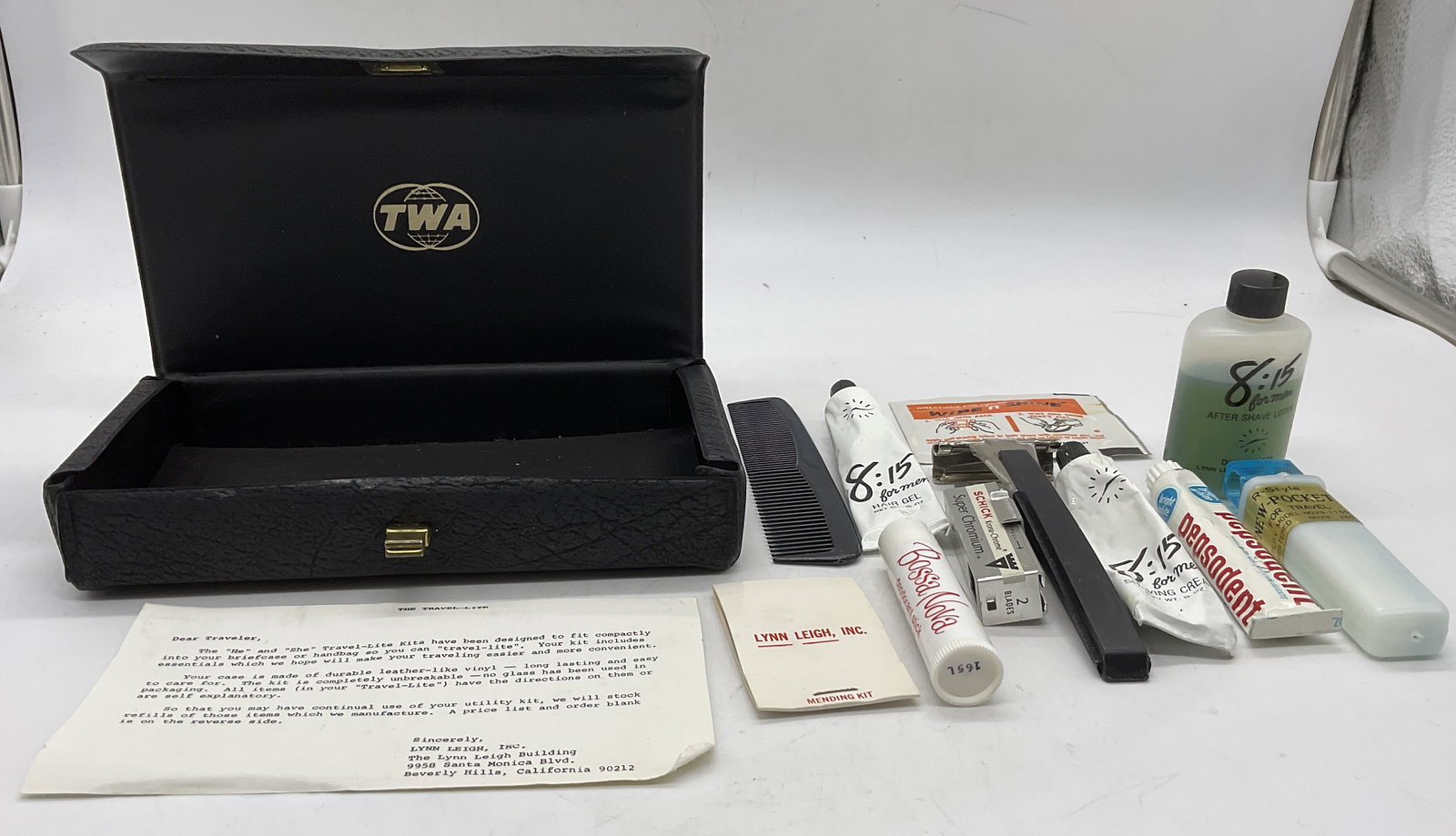 TWA He and She Vinyl Travel-Lite Kit: TWA He and She Vinyl Travel Lite Kit. Contains Wipe 'n' Shine Instant Shoe Polish Wipe. 8.15 For Men Shaving Cream. 8.15 For Men After Shave Lotion, Lynn Leigh Mending Kit, 8.15 For Men Hair Gel, Boss