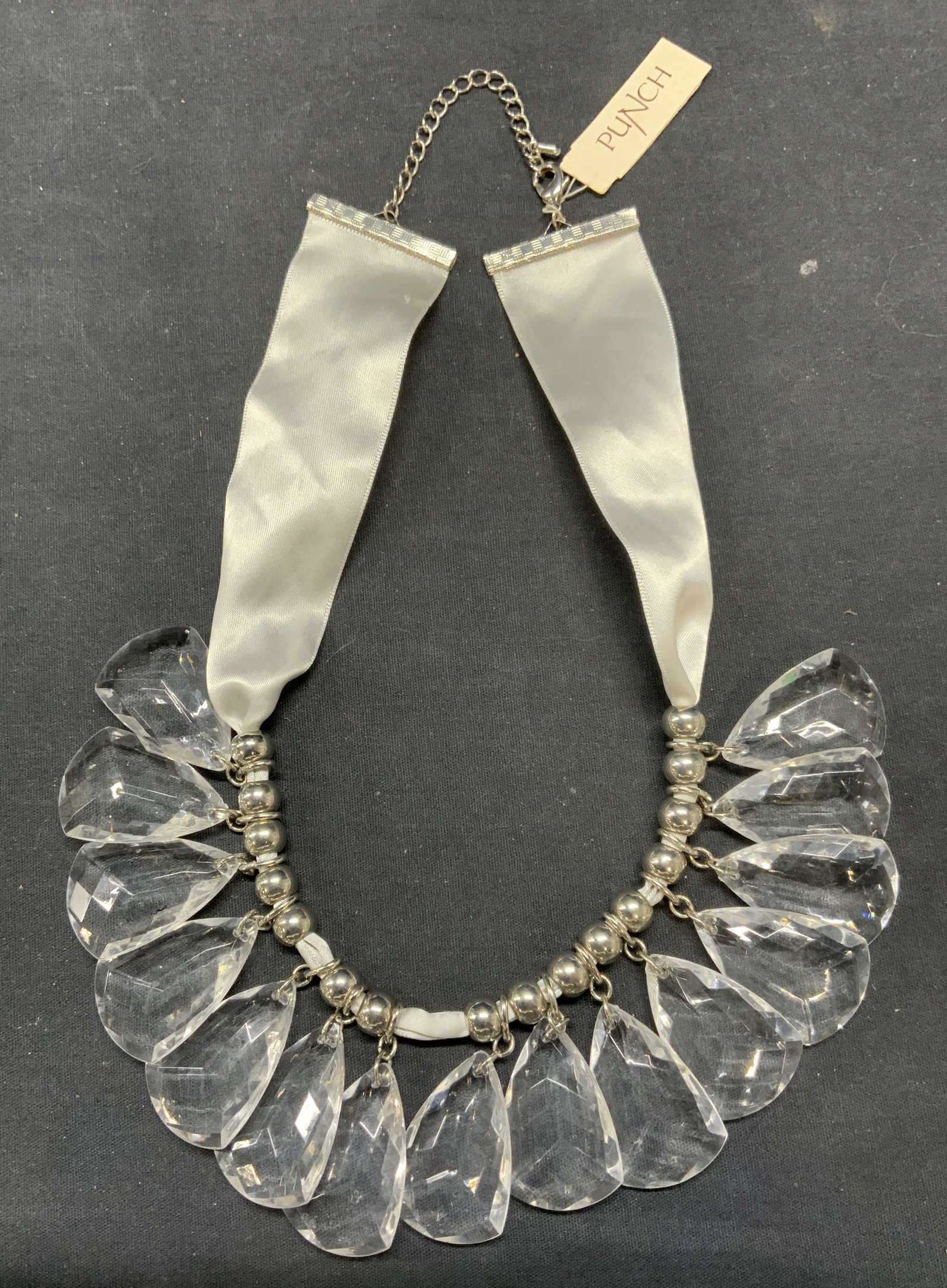 Punch Silver Tone Crystal Choker Necklace: Punch silver tone crystal choker necklace with ribbon. Signed on tag. Drop length approx. 9.5 inches. Some wear to ribbon and scratching observed. Estate jewelry, costume jewelry, cocktail, jewelry, f