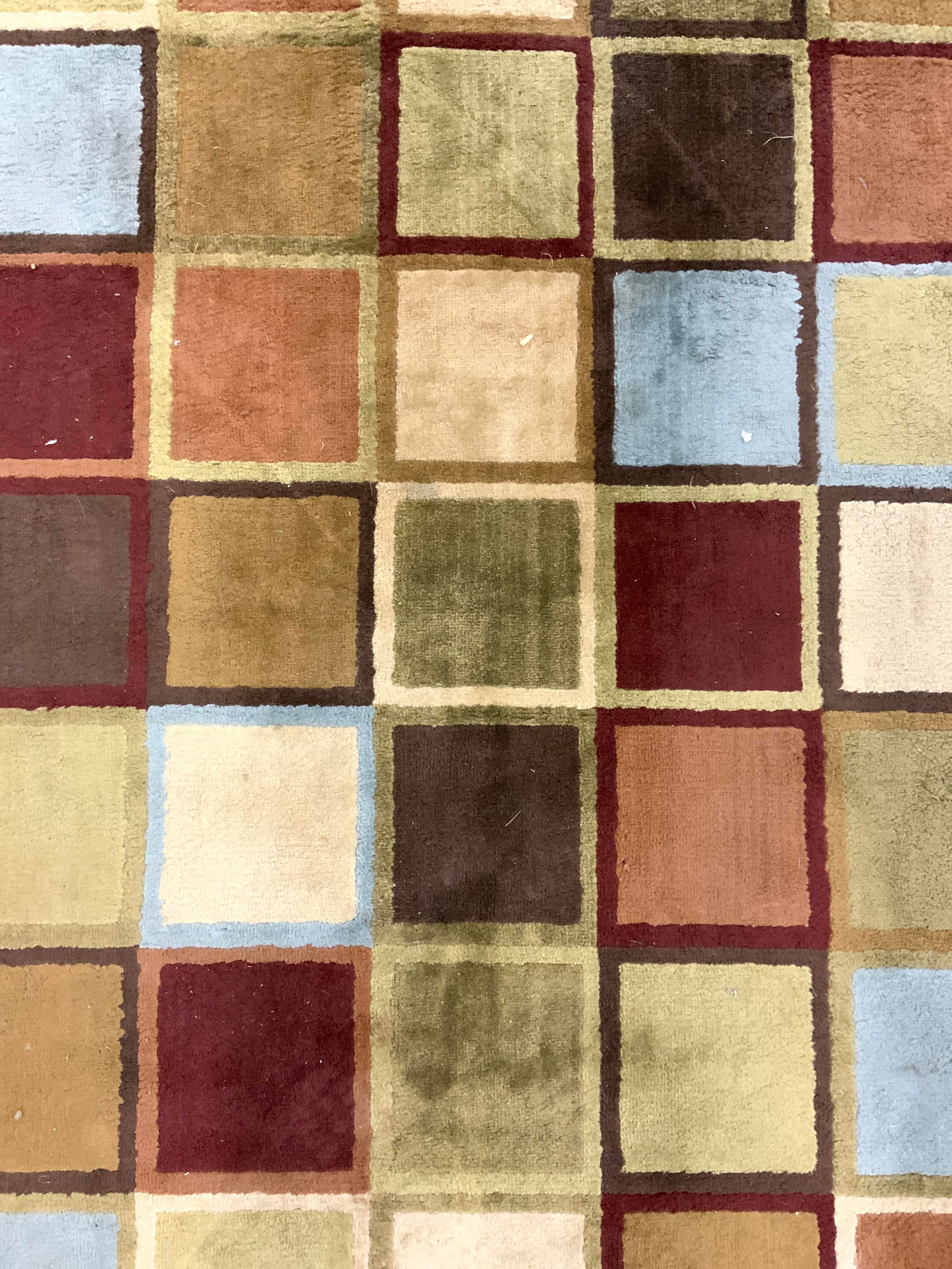 BROOKS INDUSTRIES Multi Block Olefin Rug: Tag reads BROOKS INDUSTRIES INC. Rug is olefin as states on tag. Piece has multi toned geometric block detail. Rug measures approximately 90 inches long 62 inches wide. Rug, carpet, area rug, Brooks i