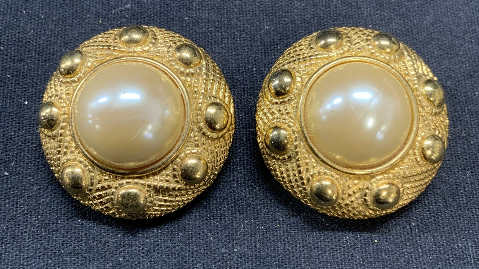 Vintage Gold Tone Faux Pearl Earrings: Vintage gold tone and faux pearl clip on earrings. Measure approx. 1.25 inches diameter. Some scratching observed. Property of Manhattan estates and fashion industry executive. Estate jewelry, costume