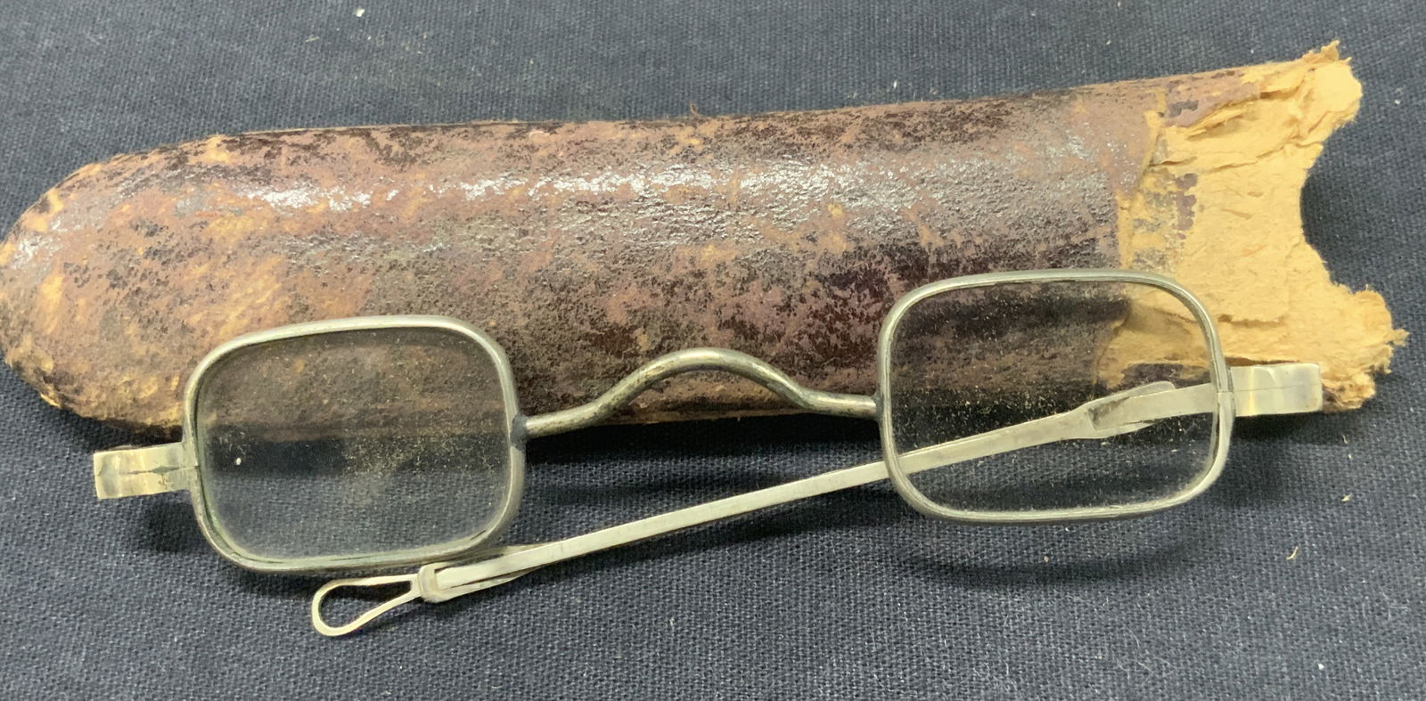 Vintage Metal Framed Spectacles W Case: Pair of vintage metal framed spectacle with rectangular lenses and extending arms. Comes in leather lined case. Glasses arms measure 4 inches long not extended lenses measure 1 inch wide and case is a
