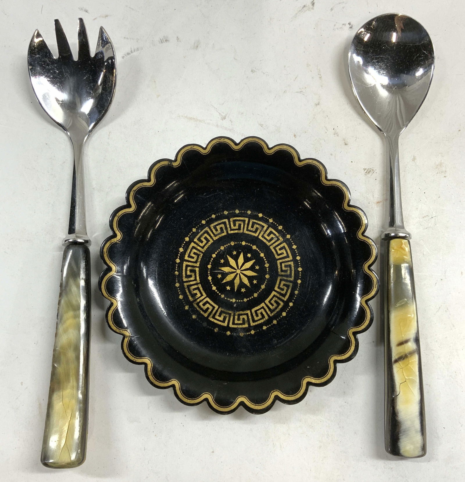 Lot 3 Lacquered Dish & Carved Bone Salad Servers: Lot includes 1 lacquered dish 1 salad serving fork & 1 salad serving spoon. Each salad serving utensils has bone handles. Lacquered dish has gilt detail near rim & medallion detail in center. Salad se