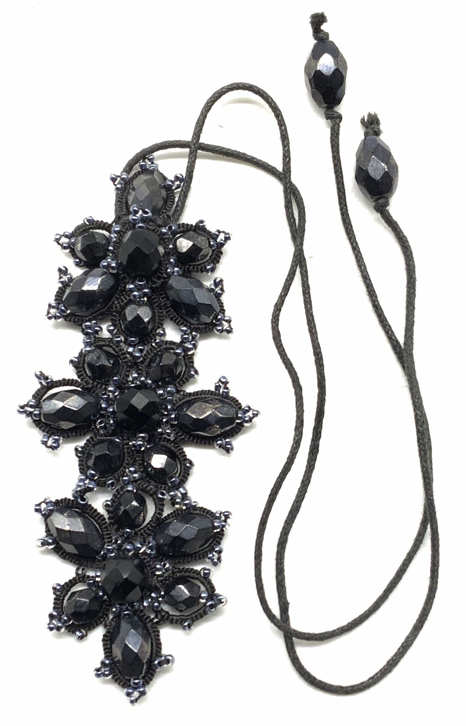 Blue & Black Crystal Pendant Necklace: Blue and black crystal pendant necklace on black cord. Drop length approx. 9 inches. Pendant measures approx. 3.5 x 1.75 inches. Some surface wear including scratching observed. Estate jewelry, costum
