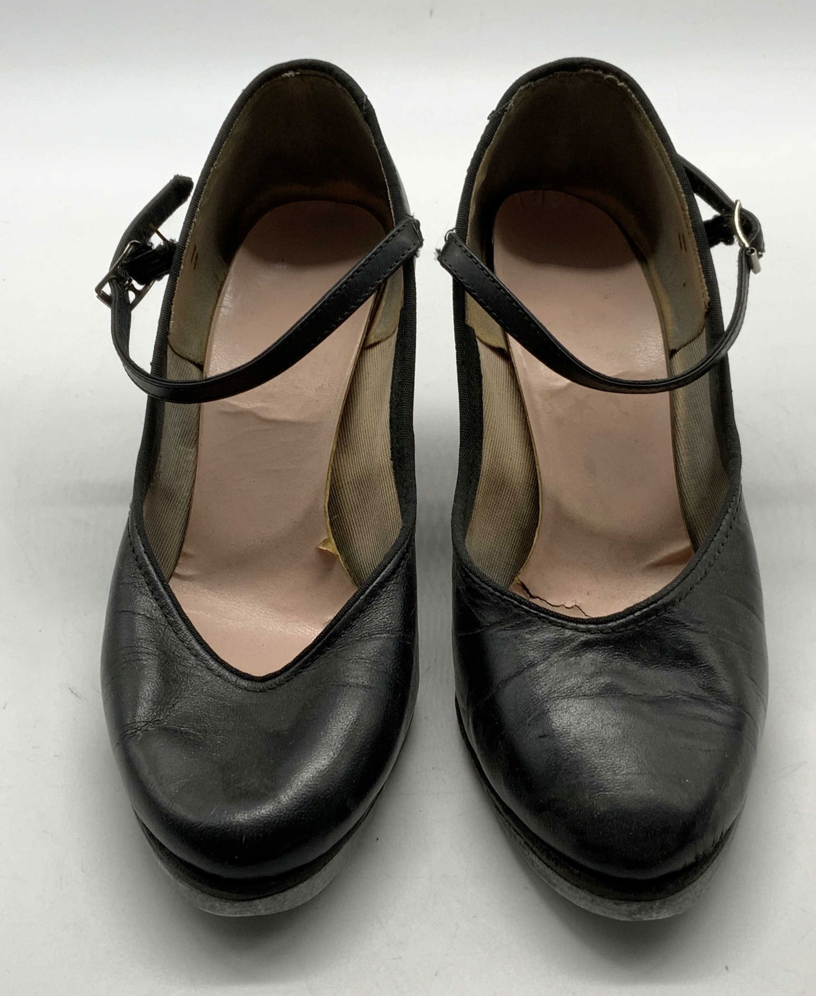 CAPEZIO Black Leather Tap Heels: CAPEZIO black leather high heel tap shoes. Measure approx. 8.5 inches long. Heel height approx. 2.5 inches. Wear to leather, insoles, and outsoles consistent with exposure. CAPEZIO, CAPEZIO heels, lad