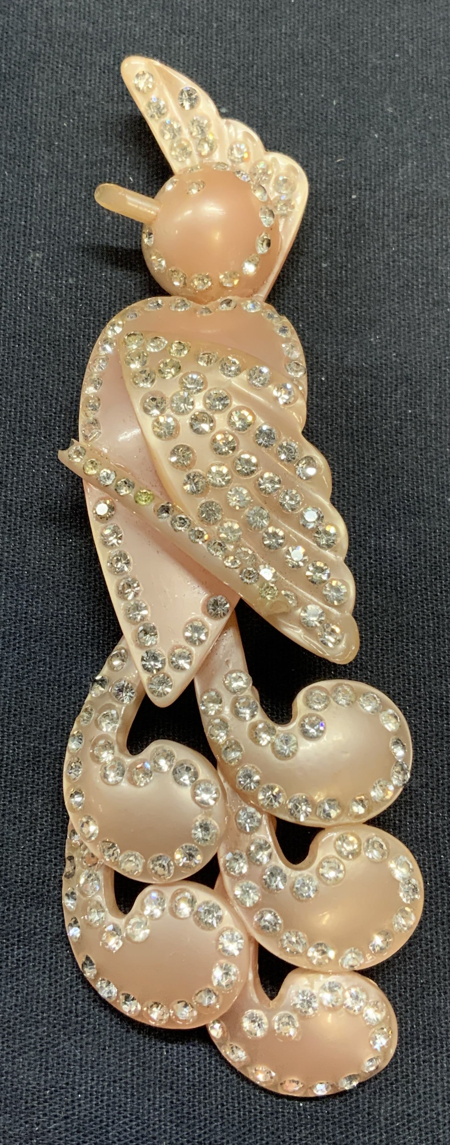 Vintage Pink Lucite Crystal Bird Brooch, 5 In: Vintage pink lucite bird brooch with crystal decoration. Measures approx. 5 x 1.5 inches. Surface wear consistent with exposure, needs repair to head. Estate jewelry, costume jewelry, fashion jewelry,