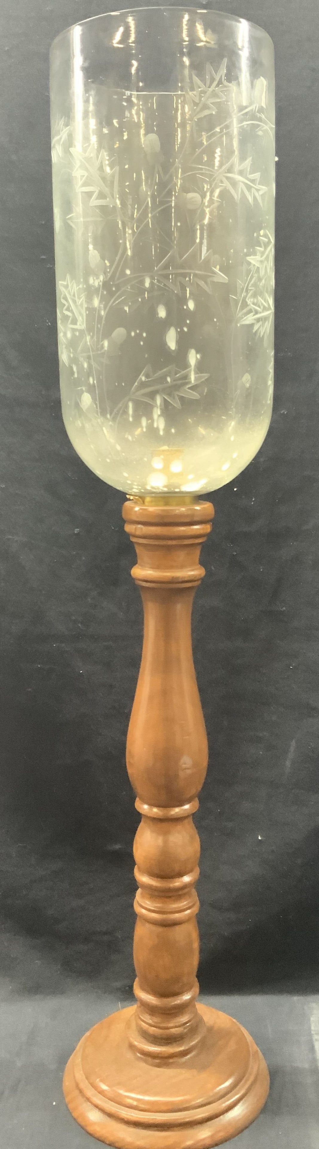 Vintage Wooden Base Hurricane Candle Stick: Vintage wooden based candle stick with etched glass Hurricane top, etched in glass with branches with leaves and carved wooden post with base. Approx 30 inches tall with a 7 inch wide base and 6.5 inc