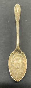 Vintage CBS Silver Plated Fruit Spoon: Vintage CBS silver plated spoon with embossed fruit motif and ornate embossed handle. Measures approx. 6 inches long. Hallmarked to underside. Marked CBS. Some surface wear including scratching observ