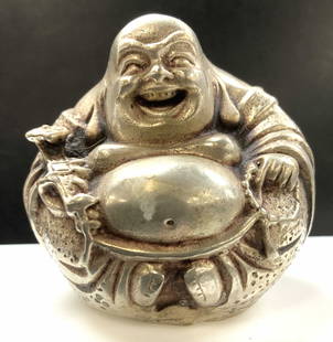 Hand Crafted Metal Laughing Buddha Figural: Artisan Tibetan silver laughing Buddha Figurine. . 2.25 in. Wide x 2.25 Ht. in. Hammered metal on backside. Buddha is holding a talisman and praying beads. Decorative Tibetan Arts, Artisan laughing Bu