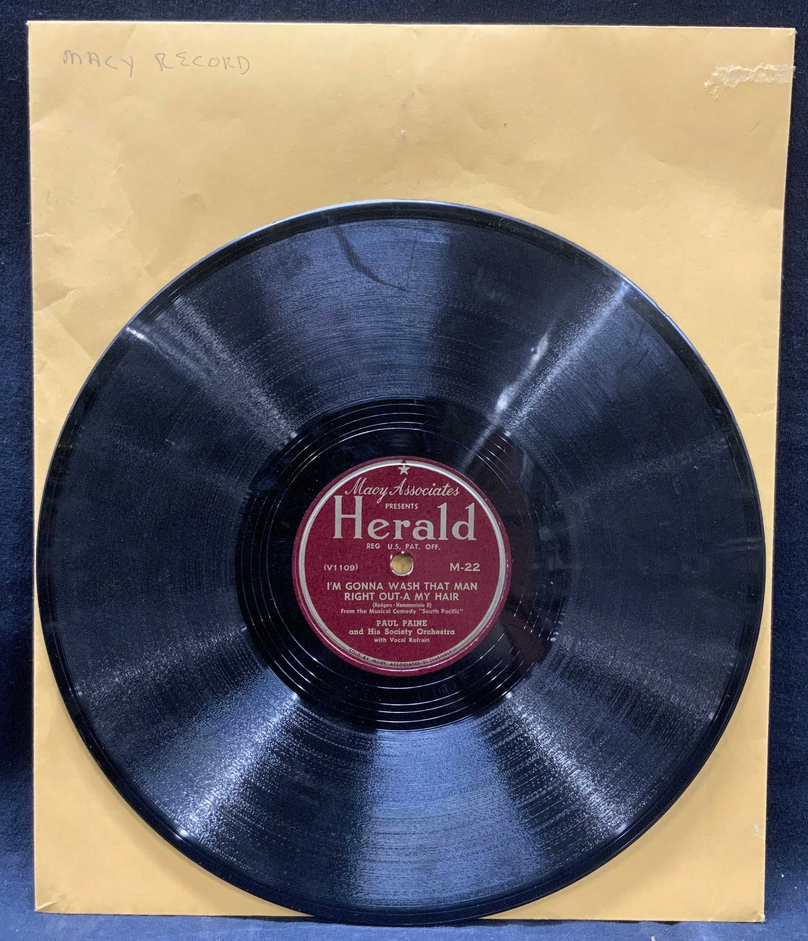 Vtg Herald Macys Exclusive Vinyl Record: Vintage Macys Associates vinyl record marked Herald, A wonderful guy, and Im gonna wash that man right out of my hair. Comes in Manila envelope. Record approx 9.75 in diameter and envelope is 10 x 12.