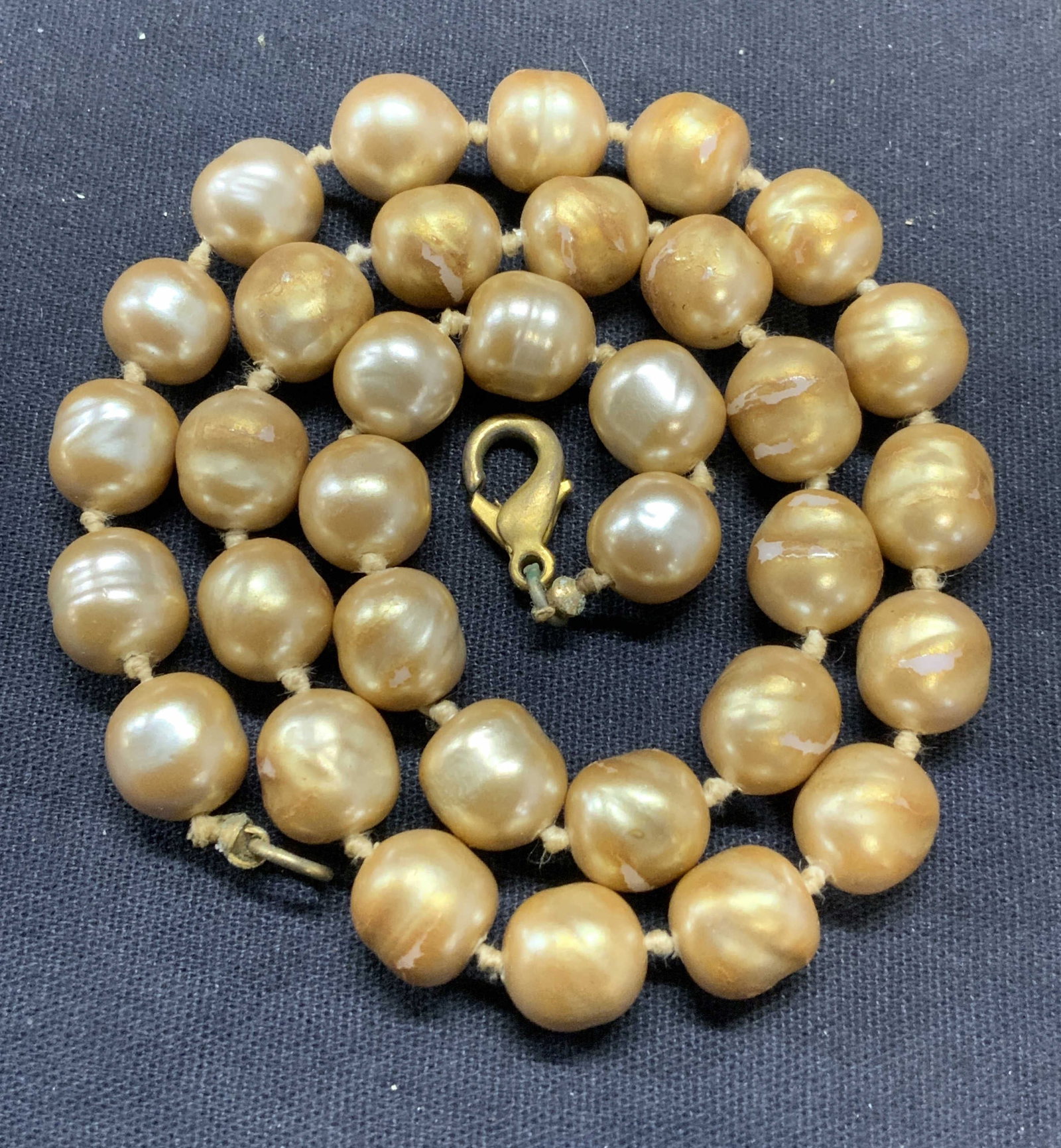 Vintage Faux Champagne Pearl Choker Necklace: Vintage faux champagne pearl beaded choker necklace on double knotted string. Drop length approx. 8 inches. Some surface wear including scratching observed. Estate jewelry, costume jewelry, cocktail j