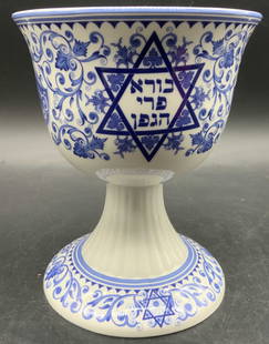 SPODE Judaica Collection Blue & White Kiddish Cup: Spode creates the cup from fine white earthenware with transfer-technique blue glazing and bases the pattern on historic Jewish manuscripts. The piece features ornate decoration inside and out, sculpt