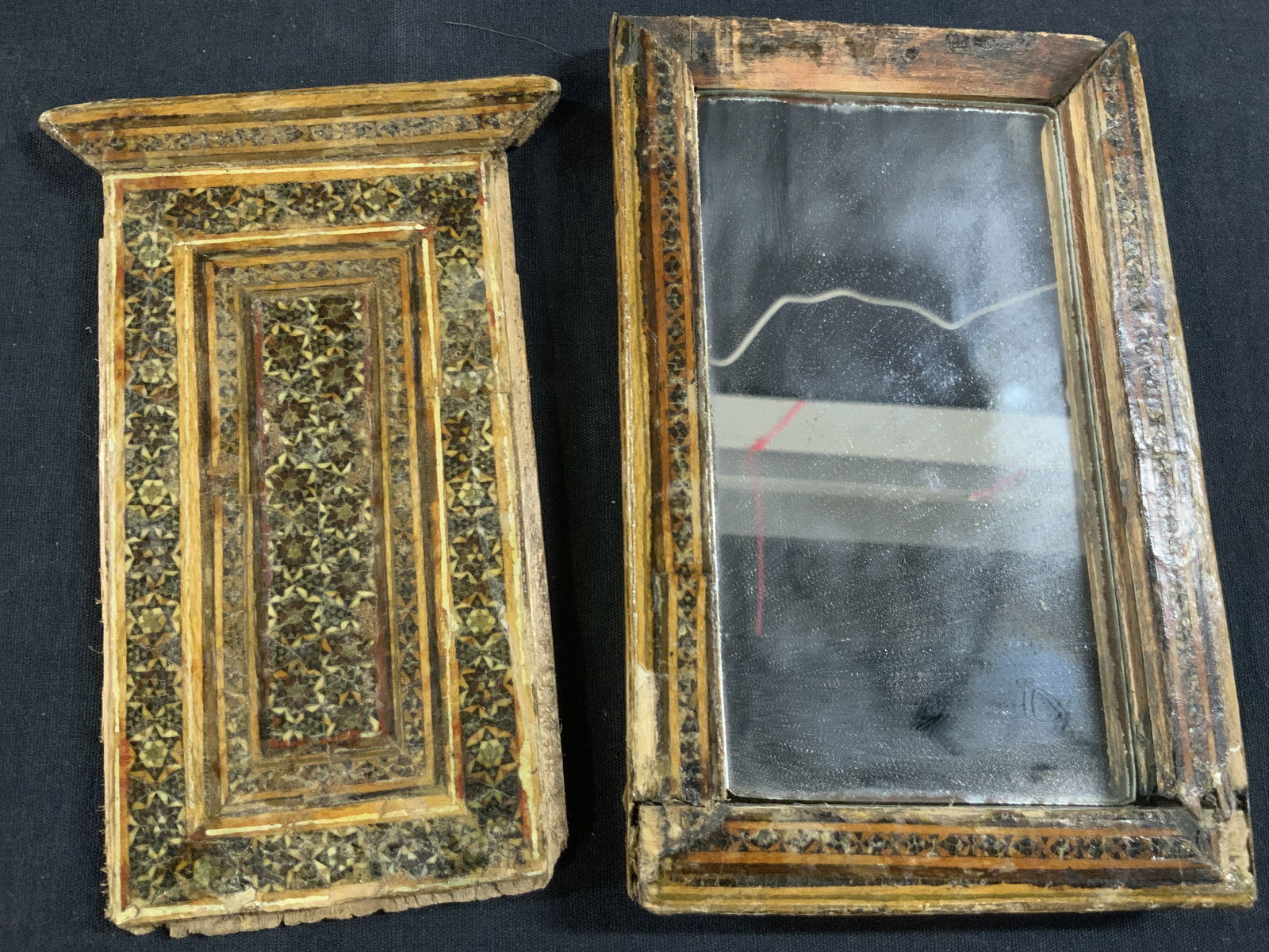 Vintage Wooden Mosaic Covered Mirror: Vintage wooden covered mirror with sliding cover. Entire frame of the mirror is inlayed with wood in mosaic styles. Approx 7 x 4 inches and Less than 1 inch thick. Evident wearing and loss to frame du