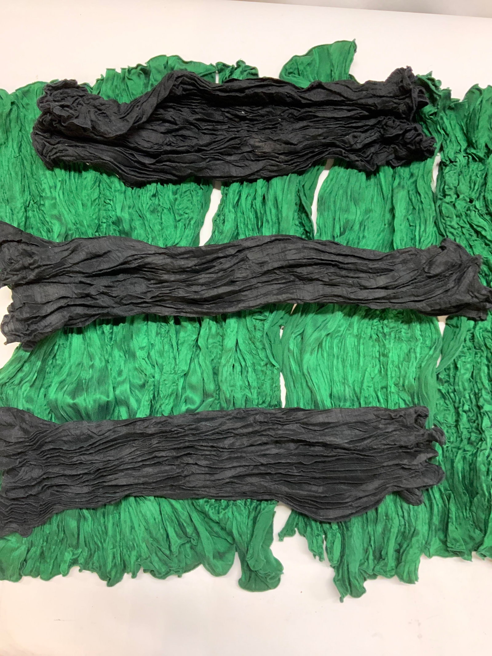ANN GISH Ruched Silk Fabrics , 17: Labeled Ann Gish All black silk fabric or all emerald green silk fabrics. Expanded they measure 32 x 20 in. In ruched state they measure 19.5 x 7.5 in. All 4 sides have seamed edges. Silk fabric, Ann 