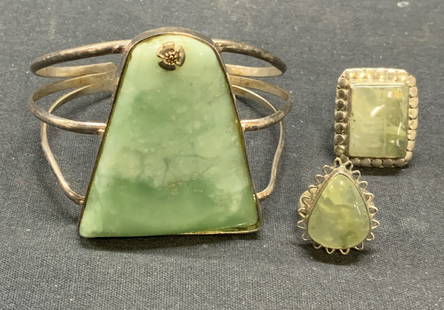 Lot3 Jewelry Sterling Silver Green Gem Rings, More: Lot of 3 jewelry pieces. 2 vintage sterling silver rings with green gemstones. Marked 925. Ring sizes 7.25 and 8. Total weight 16.2 grams. Vintage silver tone cuff bracelet with green gemstone and flo