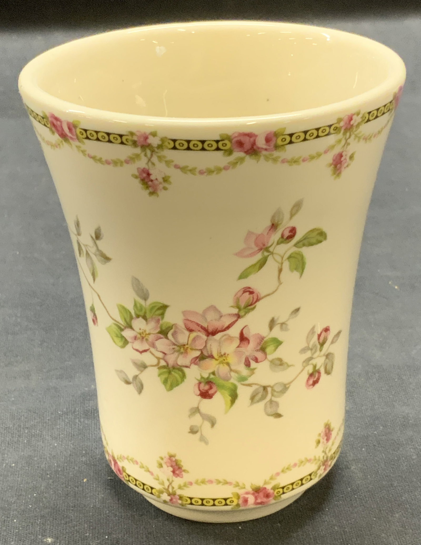 Crownford Floral Porcelain Cup, England: Vintage Crownford Giftware porcelain cup with floral motif. Trademarked to underside. Made in England. Measures approx. 3.25 x 4.25 inches. Some surface wear including scratching observed. Crownford, 