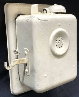 Antique Painted Metal Wall Phone: Antique wall phone, painted off white. Main speaker in the center with a bell on the top and hook on the side that would originally hold the speaking apparatus. Approximately 8 x 6 inches. Evident wea