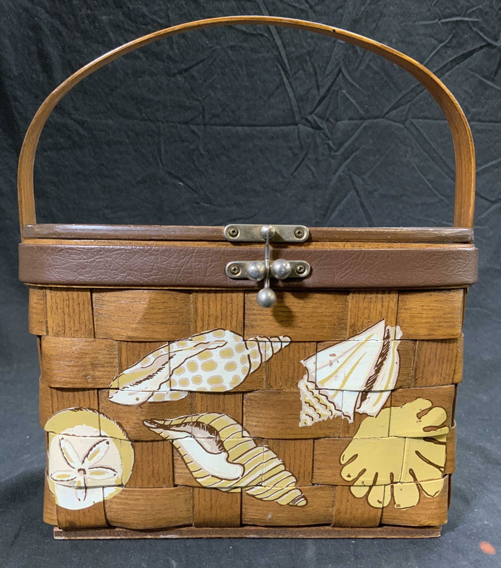 CARO NAN Vntg Woven Basket W Shell Detail & Handle: Underside of lid is signed CARO NAN MADE IN USA. Basket is vintage. Piece is light brown toned with woven structure. Interior is lined with multi toned floral detailed fabric. Basket is lidded & has a