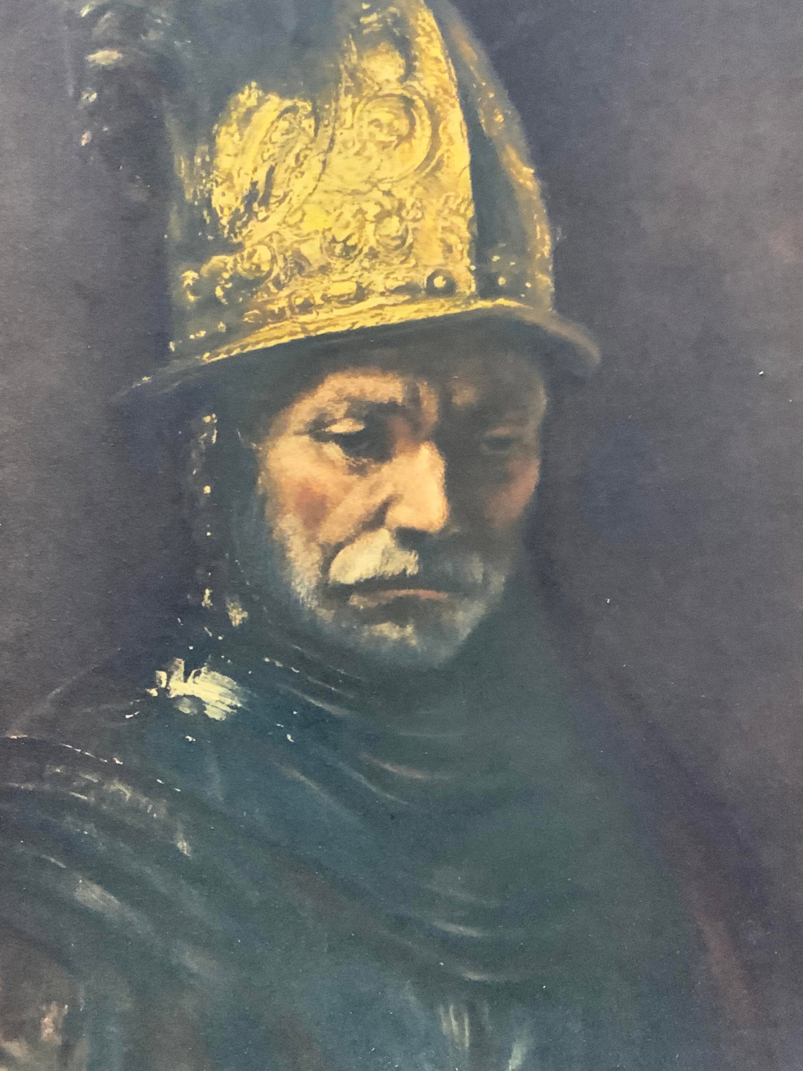 Rembrandt The Man With The Golden Helmet Litho: Lithograph of the men with the golden helmet by Rembrandt affixed to a backboard. No frame. Approx 16 x 13 inches Moderate wearing to lithograph and to edges and corners. Rembrandt fine art litho, fin