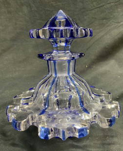 Vintage Bohemian Glass Decanter W Stopper: Decanter is vintage. Piece has various blue toned areas. Vessel includes stopper. Sides of piece flare outward. Piece measures approximately 5.5 inches tall 5 inches wide. Evident chips and scratches