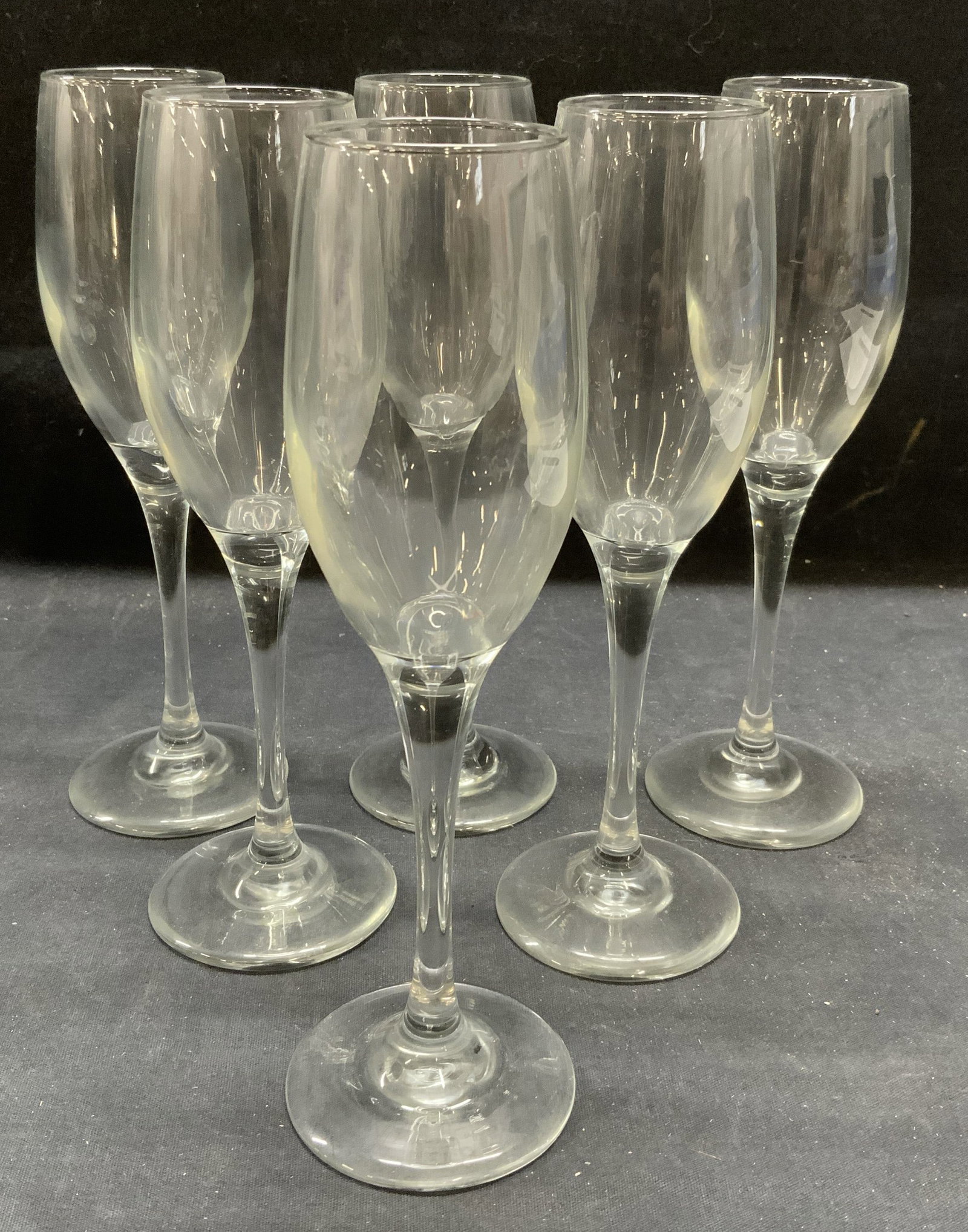 Set 6 Vintage Wine Glass Flutes: Set of 6 vintage wine/champagne glass flutes. Tapered stems and narrow bodies. Pieces have weight. Measure approx. 2.75 x 8.5 inches each. All pieces have some surface wear including scratching observ