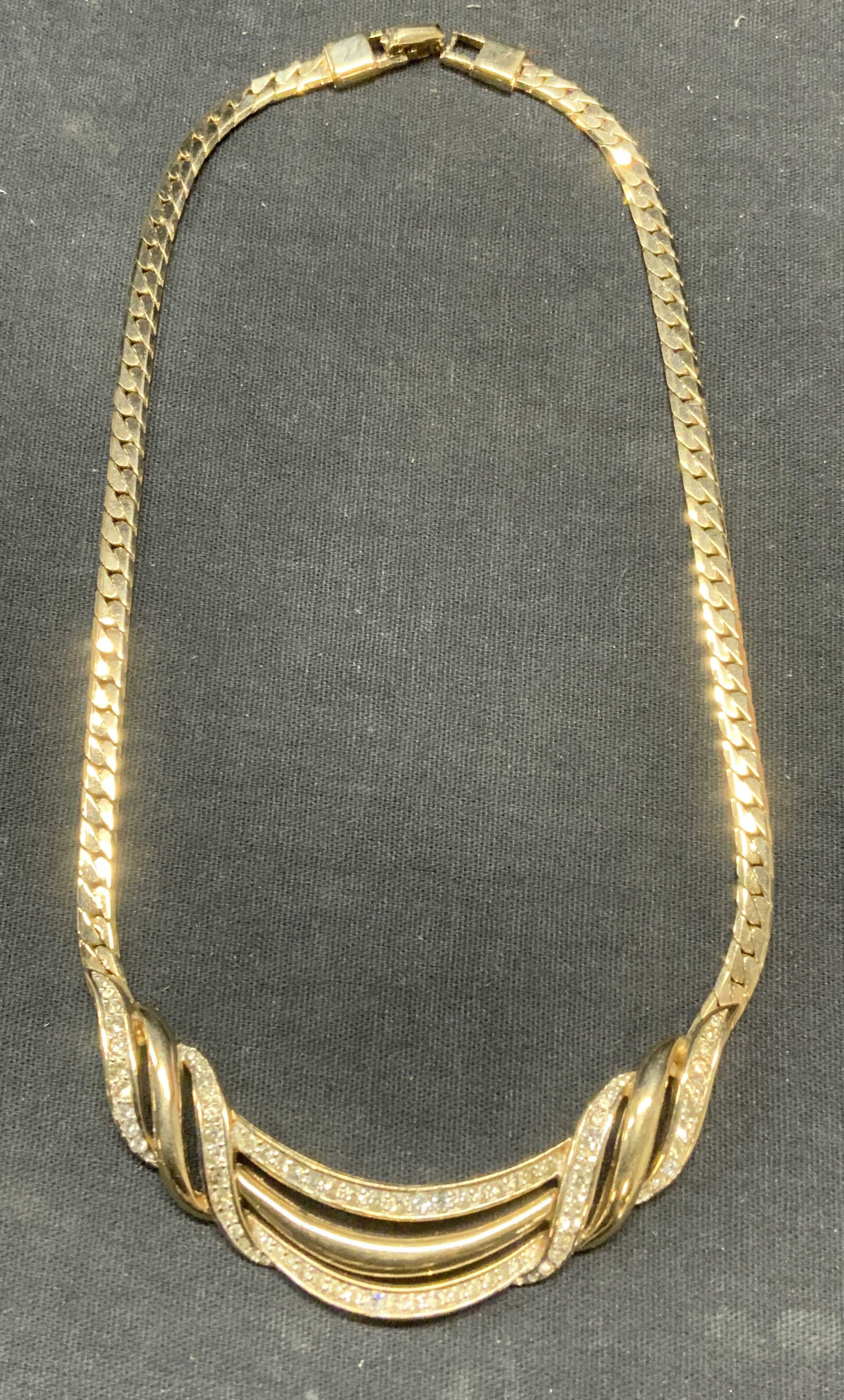 Vintage PANETTA Gold Tn Crystal Necklace: Vintage PANETTA gold tone choker necklace with colorless crystal decoration. Signed to underside. Drop length approx. 7 inches. Includes box. Some surface wear including scratching observed. Estate je