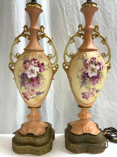 Pair Vintage Porcelain Art Nouveau Table Lamps 35i: Lot includes 2 lamps, each are vintage. Lamp each have intricate multi toned floral and leaf detail. Lamps each have 2 bulb sockets with beaded pull switches. Bases are each gilt metal & have intricat