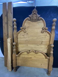 Vintage Carved Wood Headboard & Footboard: A vintage carved wood headboard and footboard. Carved foliage motif throughout. Rounded posts. Comes with rectangular pieces of wood, some writing to pieces. Metal hardware to the footboard and headbo