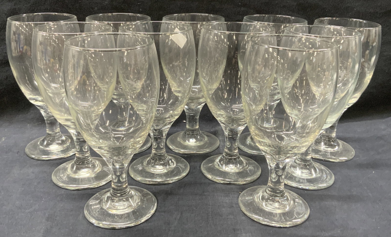 Set 12 Clear Glass Stemware: Set of 12 clear glass wine glasses with solid glass bases. Approx 7 inches tall and 3 inch diameter. Moderate wearing to glass and scratches observed. Glassware, glass stemware, stemware, home decor, 