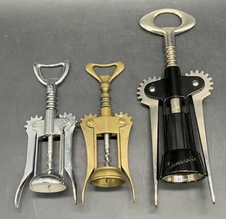 3 Bottle Openers / Corkscrews, CAVEZNELLO & More: CAVEZNELLO and more vintage bottle openers / corkscrews. These three vintage pieces are crafted from silver and brass toned metal. Largest measures approx. 9.75L x 3.5W in. Some surface wear consisten