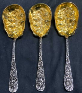 GODINGER 3 Silver & Gold Plated Serving Spoons: Undersides of each piece reads GODINGER. Spoons each have gold toned basins & silver toned handles. Basins each have beveled strawberry vine & leaf detail. Handles each have floral relief detail. Each