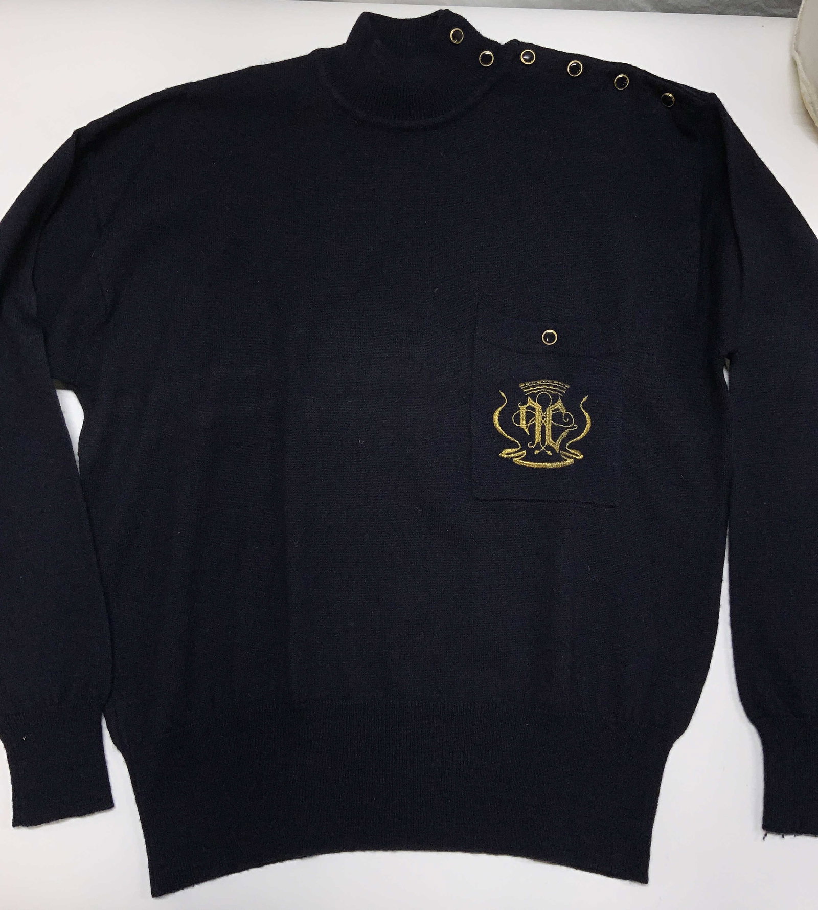 Jones New York Lambswool Blend Sweater: Navy blue sweater with button up the side of the shoulder to the neck. Embroidered crest on chest pocket. Size Large, 52% acrylic, 48% lambswool. Sweater, Jones New York sweater, vintage wear, estate 