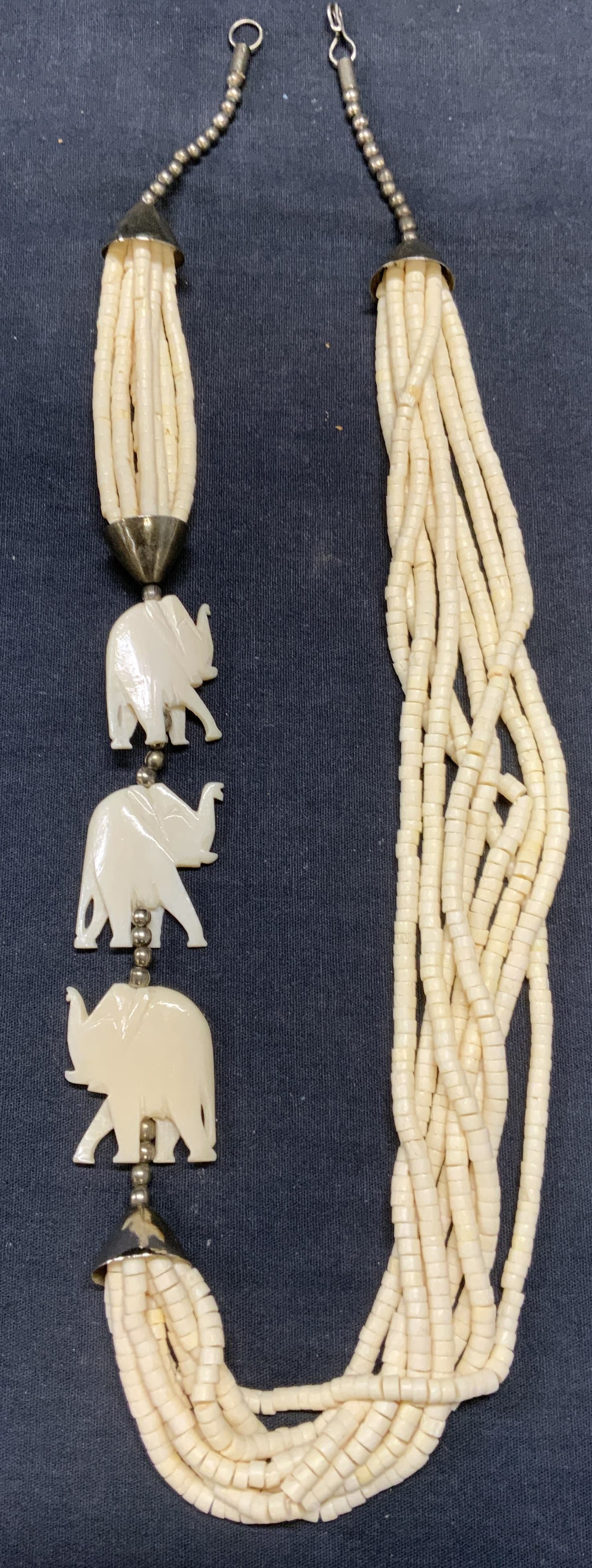 Vintage Elephant Pendant Bone Necklace: Vintage elephant pendant necklace. Possibly carved bone beads. Drop length approx. 13.25 inches. Some surface wear including scratching observed. Estate jewelry, costume jewelry, cocktail jewelry, fas