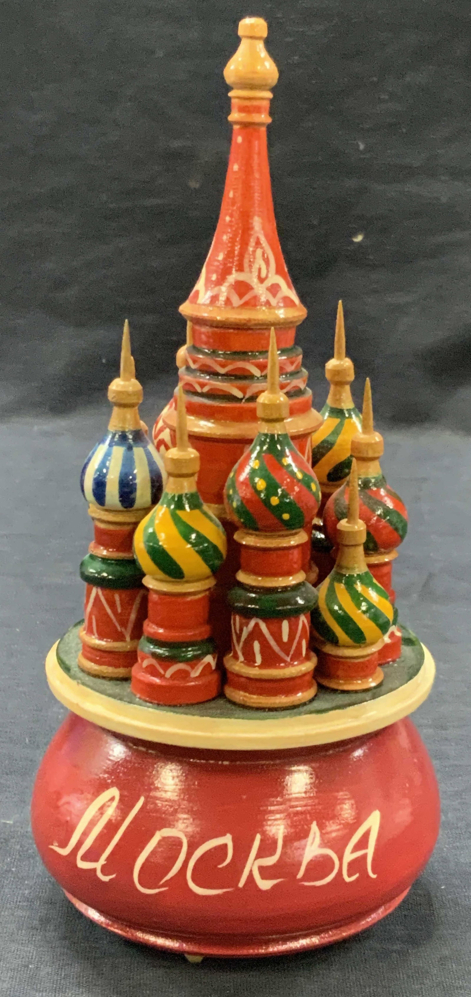 Hand Painted Wooden Russian Music Box: Hand painted music box with Russian painted on body and wooden onion spires depicting Saint Basils Cathedral Approx 7.5 inches tall and 3 inch diameter. Not tested for functionality Minor wearing to w