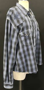 Ryan Michael Silk & Cotton Combo Plaid Shirt: Soft hand blue and black plaid shirt with snap buttons. Size XL . 55% silk 30% cotton, and polyester fabric. Front snap pockets. 26 in. Long. Unisex wear. Metal snap buttons with star motif. Ladies sh